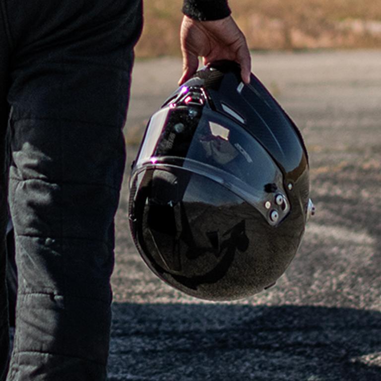 A person carrying a helmet