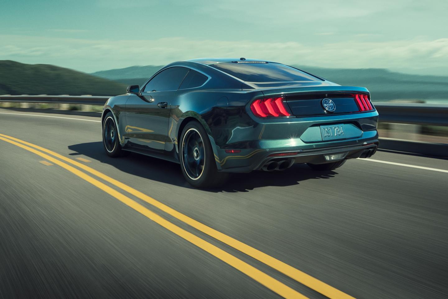 Mustang Fastback driving on a highway.