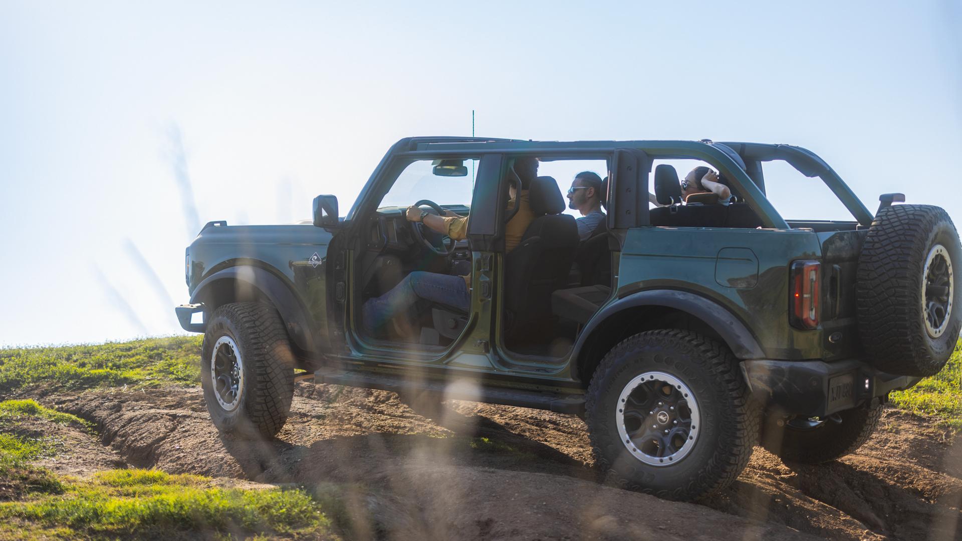 A 2025 Ford Bronco® SUV with the doors removed, parked at the end of a trail