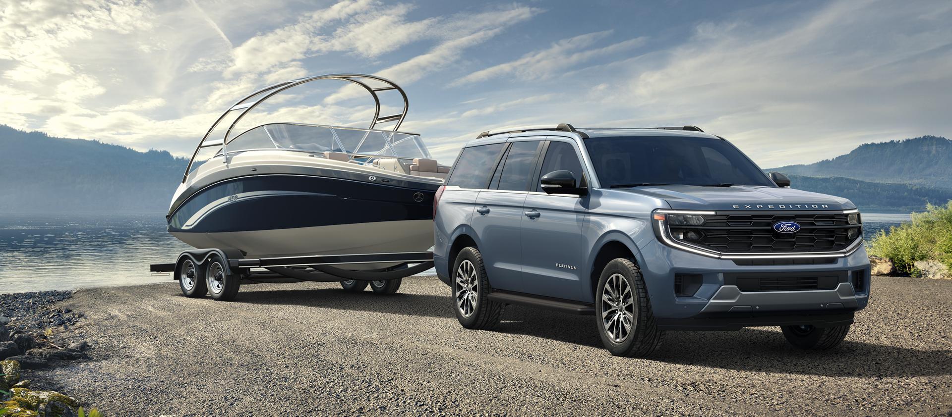 2026 Ford Expedition® model with a driver towing a boat on a trailer