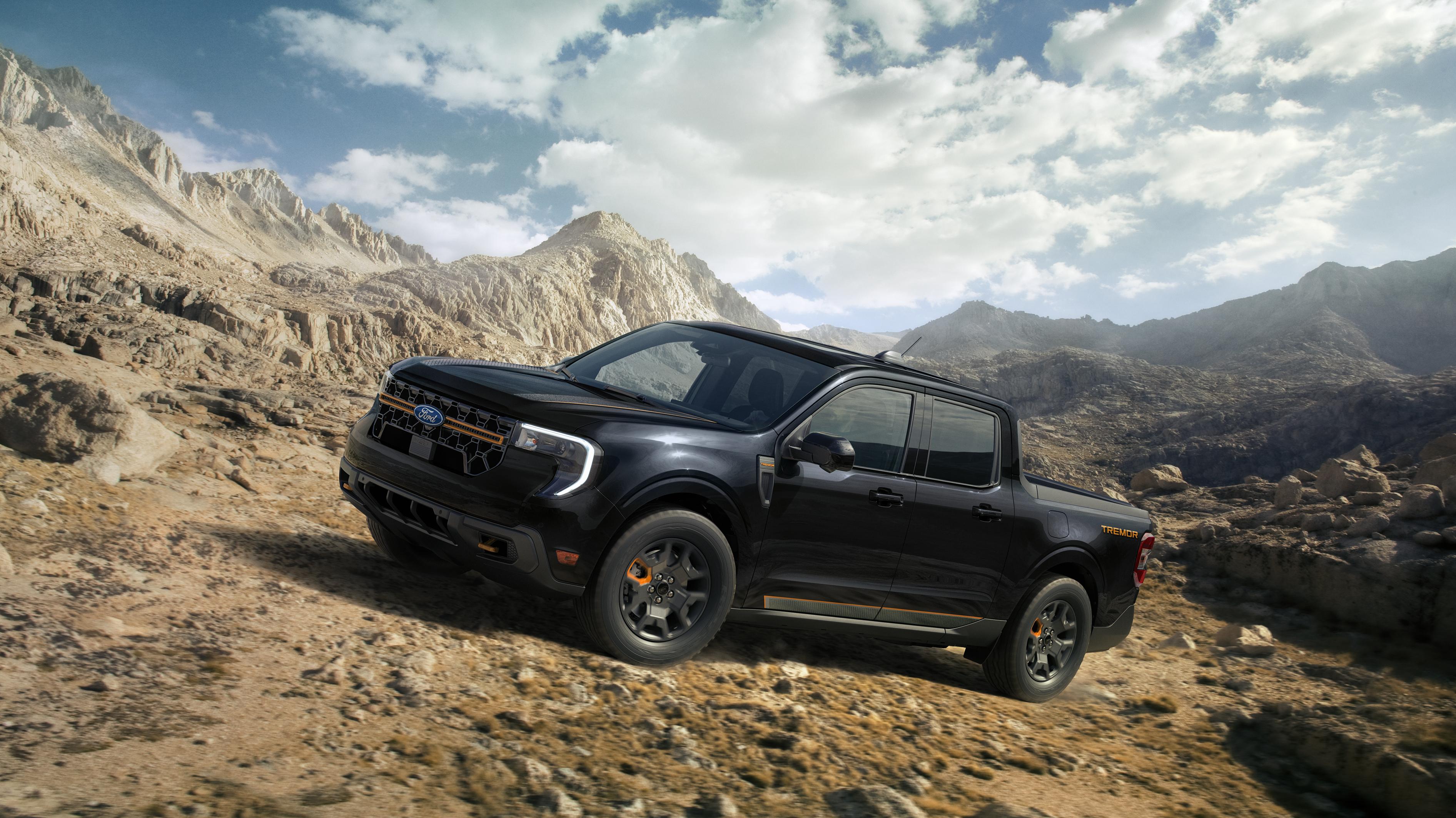 A 2026 Ford Maverick® Tremor® model being driven up a rocky hillside