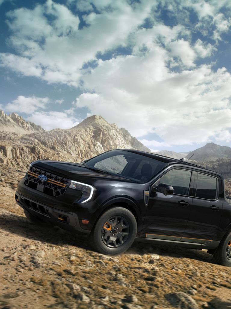 2026 Ford Maverick® Tremor® driving up a rocky hillside