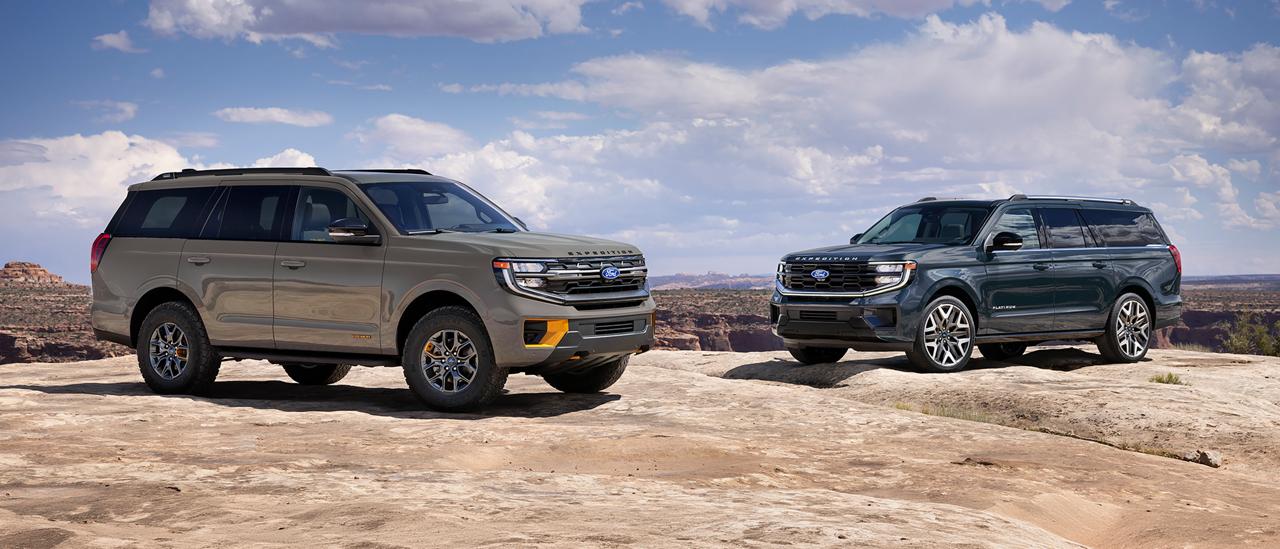 A 2027 Ford Expedition® Tremor® and an Expedition Platinum™ model parked on a rocky outcrop