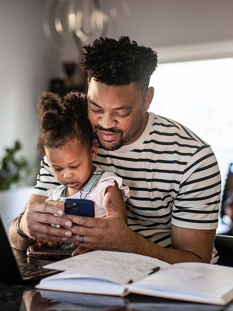 Family looking at a mobile phone