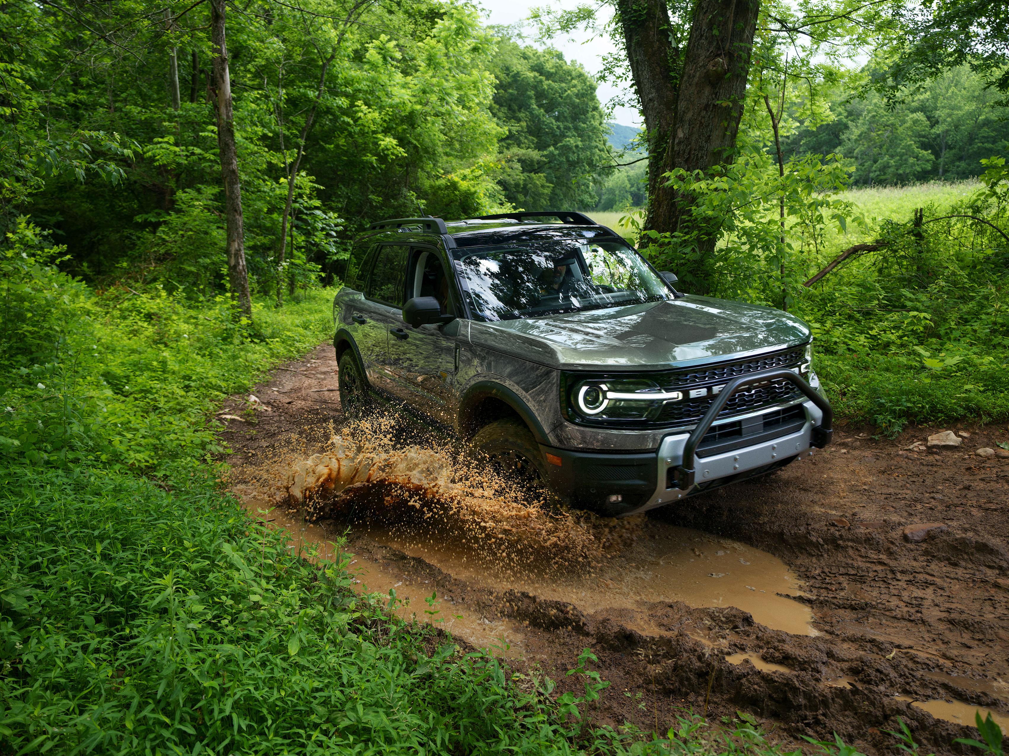 A 2026 Ford Bronco Sport® Badlands® SUV being driven through mud