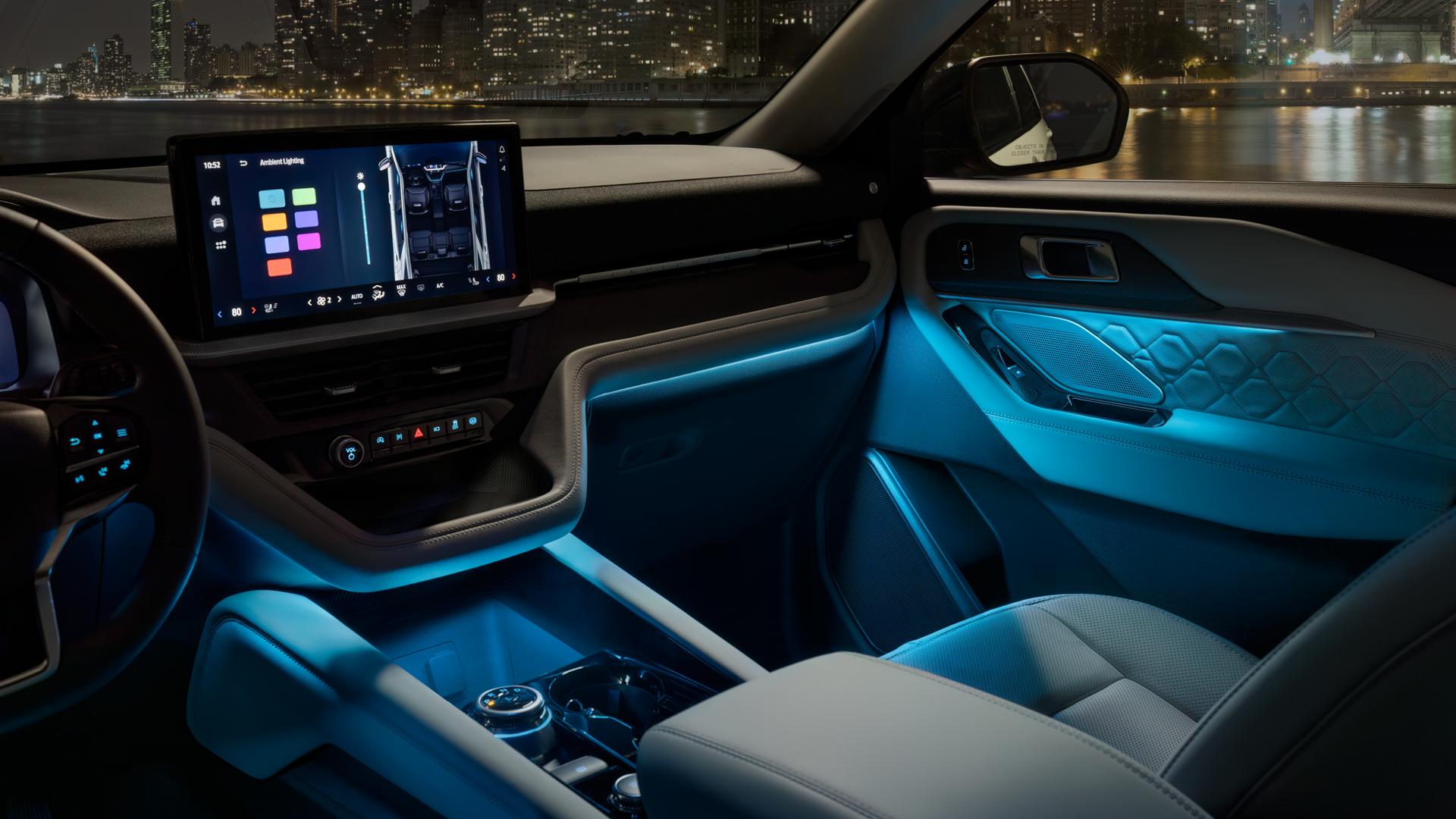 The interior of a 2026 Ford Explorer® SUV with Ambient Lighting on