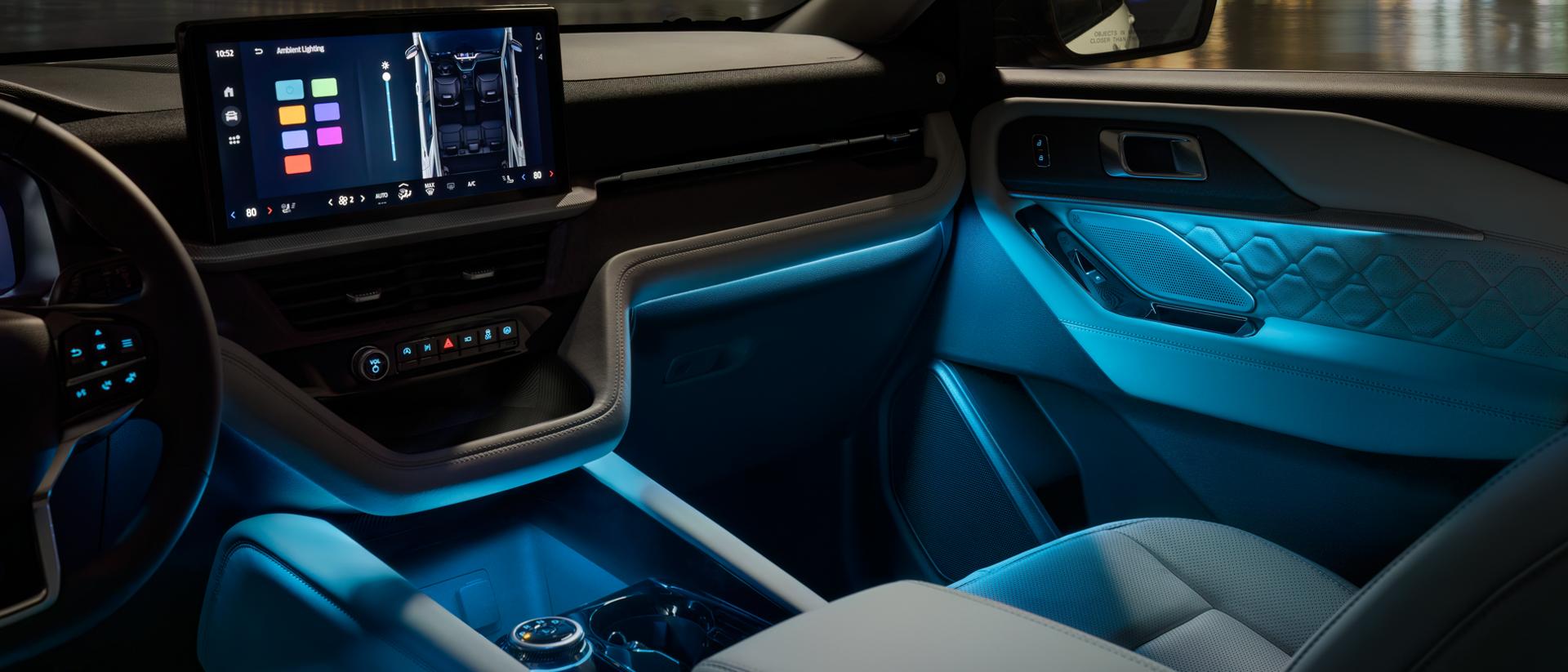 The interior of a 2026 Ford Explorer® SUV with Ambient Lighting on