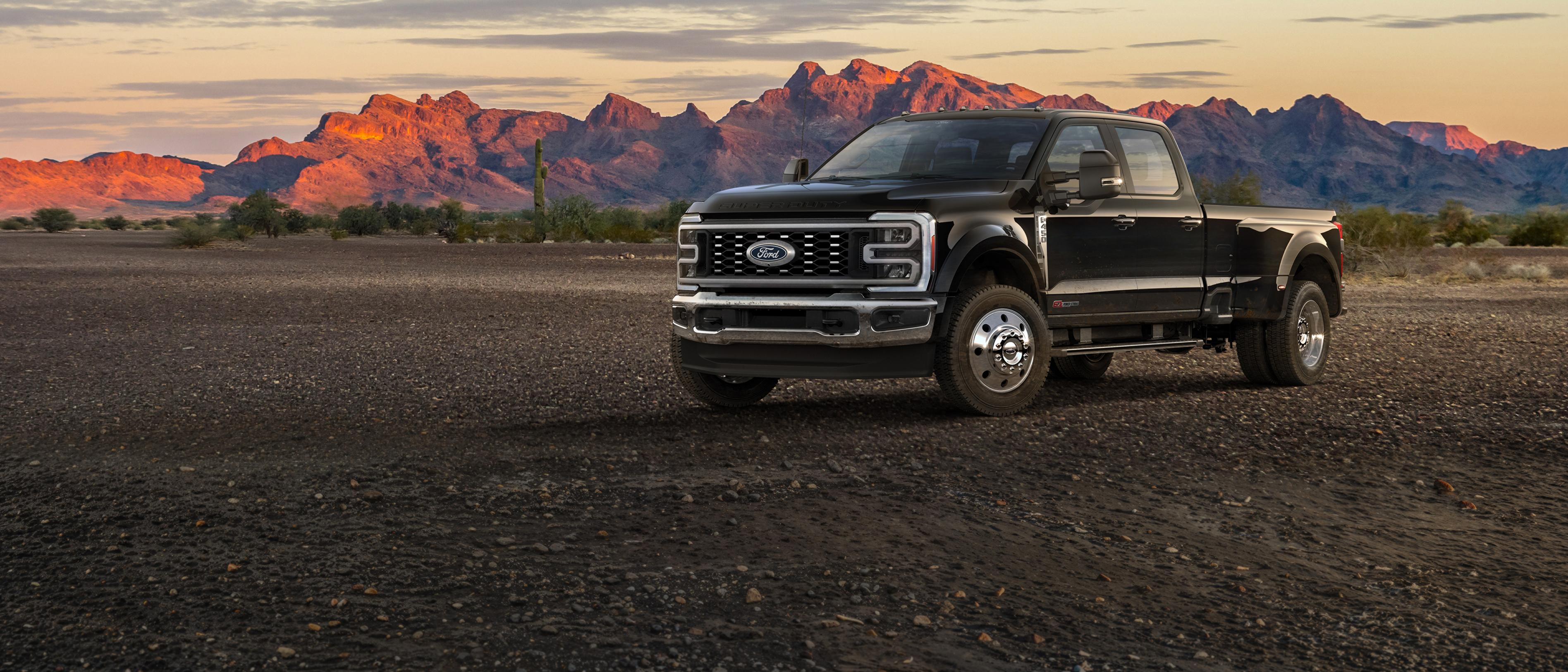 2027 Ford Super Duty® F-450® Lariat® truck parked on a dirt road in the mountains