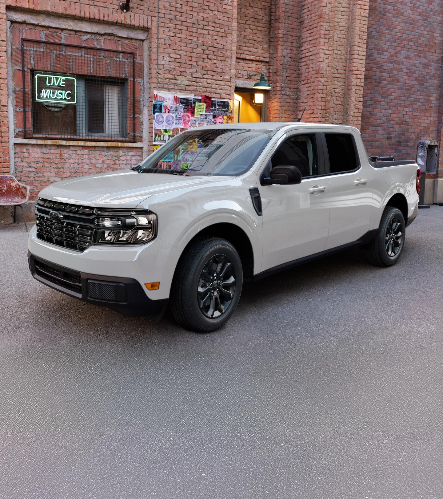 A Ford Maverick® parked in front of a small independent music store