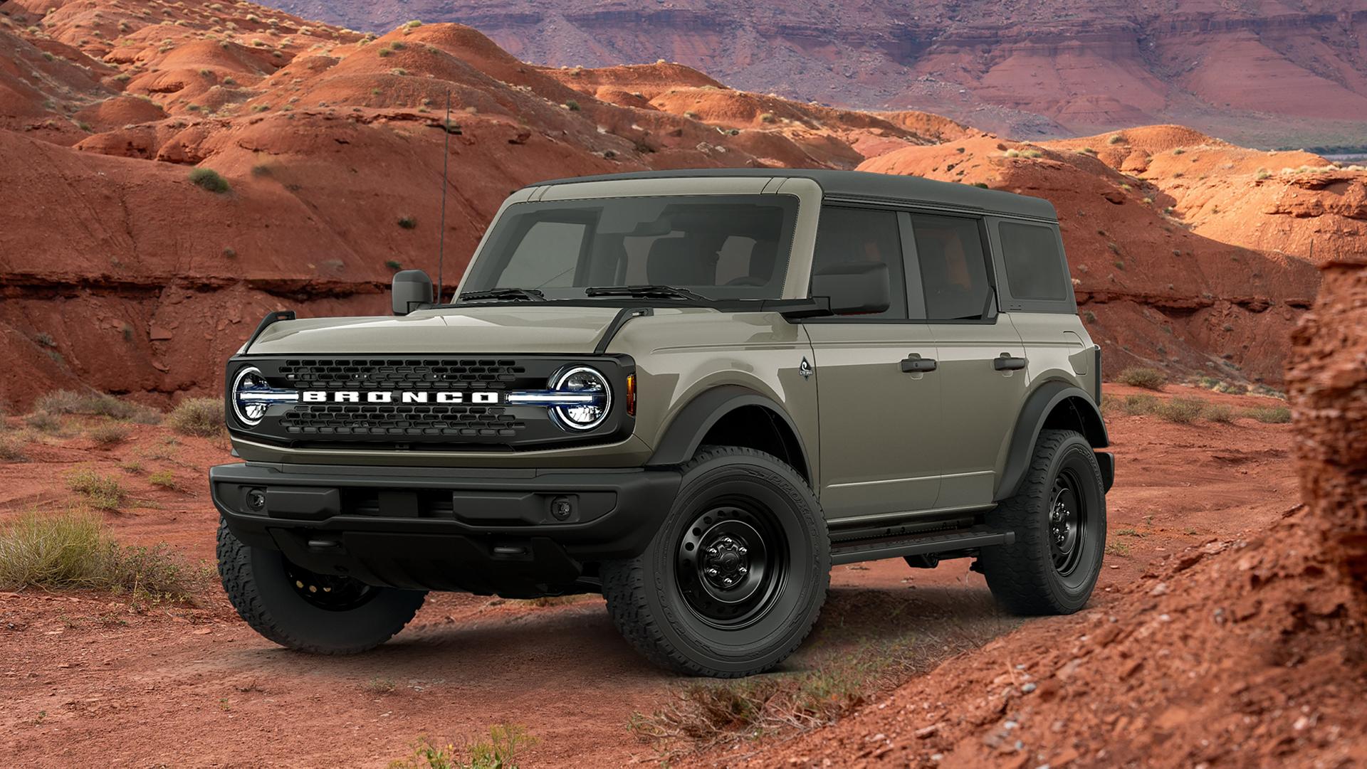 A 2026 Ford Bronco® SUV with the available Black Appearance Package parked in front of a red mesa