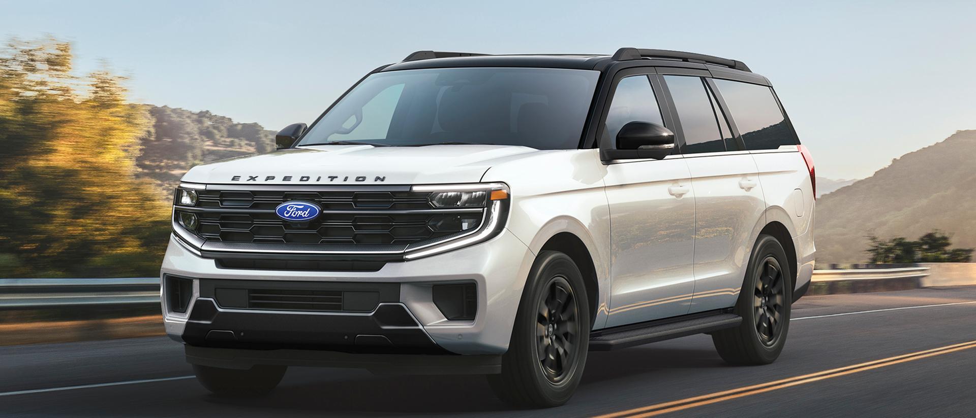 A 2027 Ford Expedition® Platinum™ SUV being driven on a street