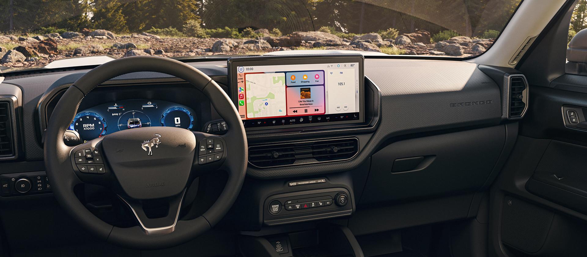 2026 Ford Bronco Sport® SUV interior highlighting the steering wheel and centre display with SYNC® 4 with Apple CarPlay compatibility shown