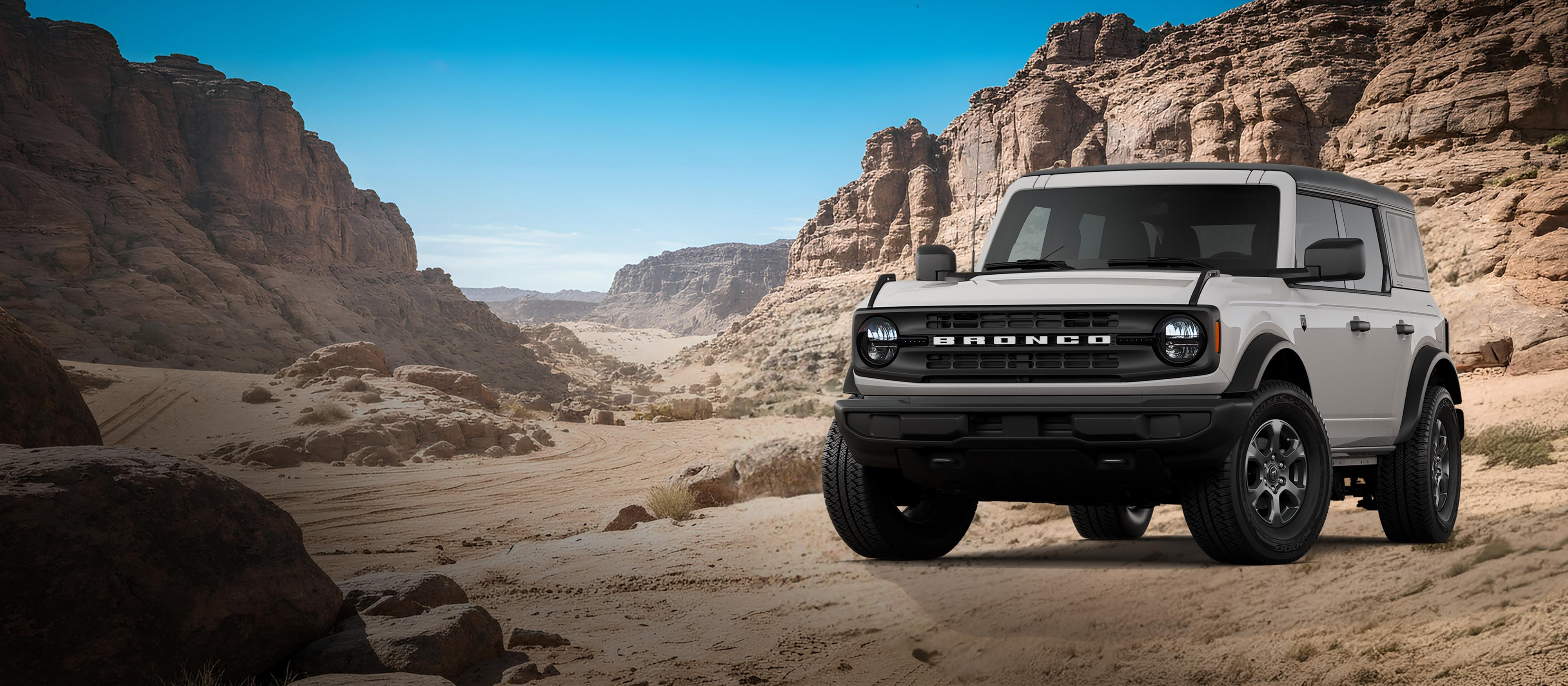 A 2026 Ford Bronco® Big Bend model shown in Avalanche Grey parked on a rocky expanse