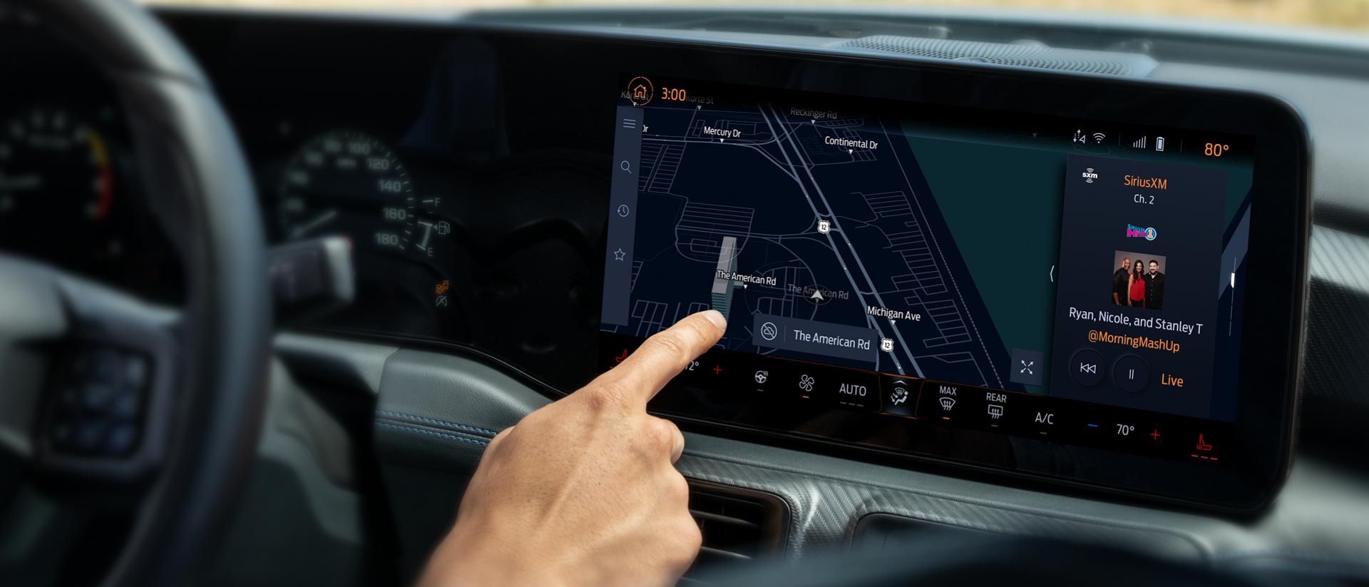 Driver using the 2026 Ford Mustang® 13.2" LCD capacitive touchscreen with swipe capability