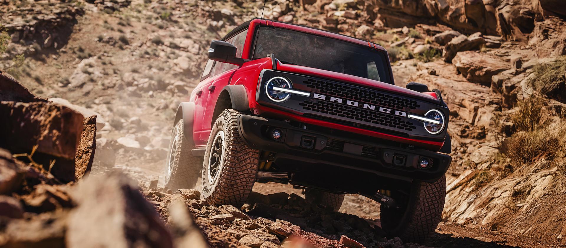 A 2026 Ford Bronco® SUV descending a muddy hill