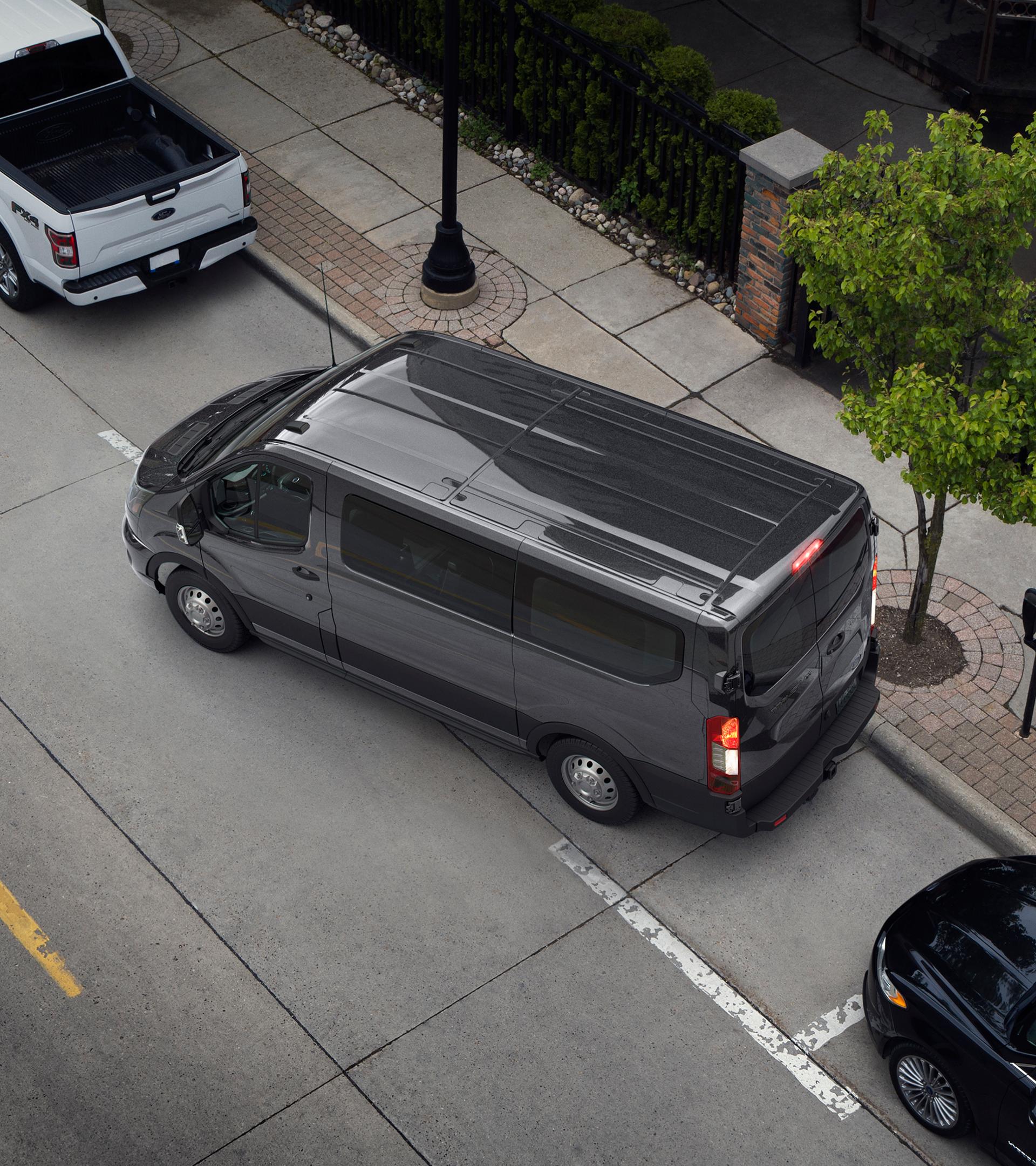 Bird's-eye view on a 2026 Ford Transit® van parallel parking