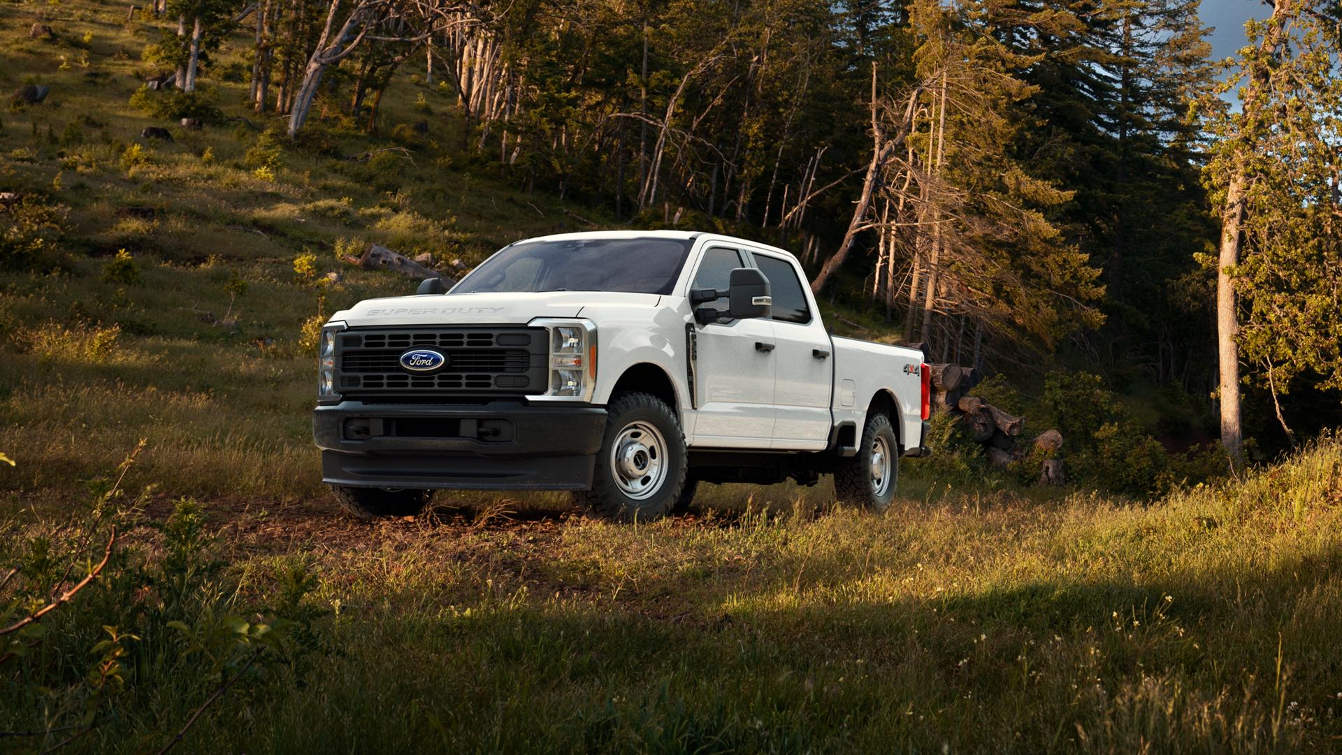 2026 Ford Super Duty® F-350® with the new Lariat® Premium Package parked in a grassy wooded area