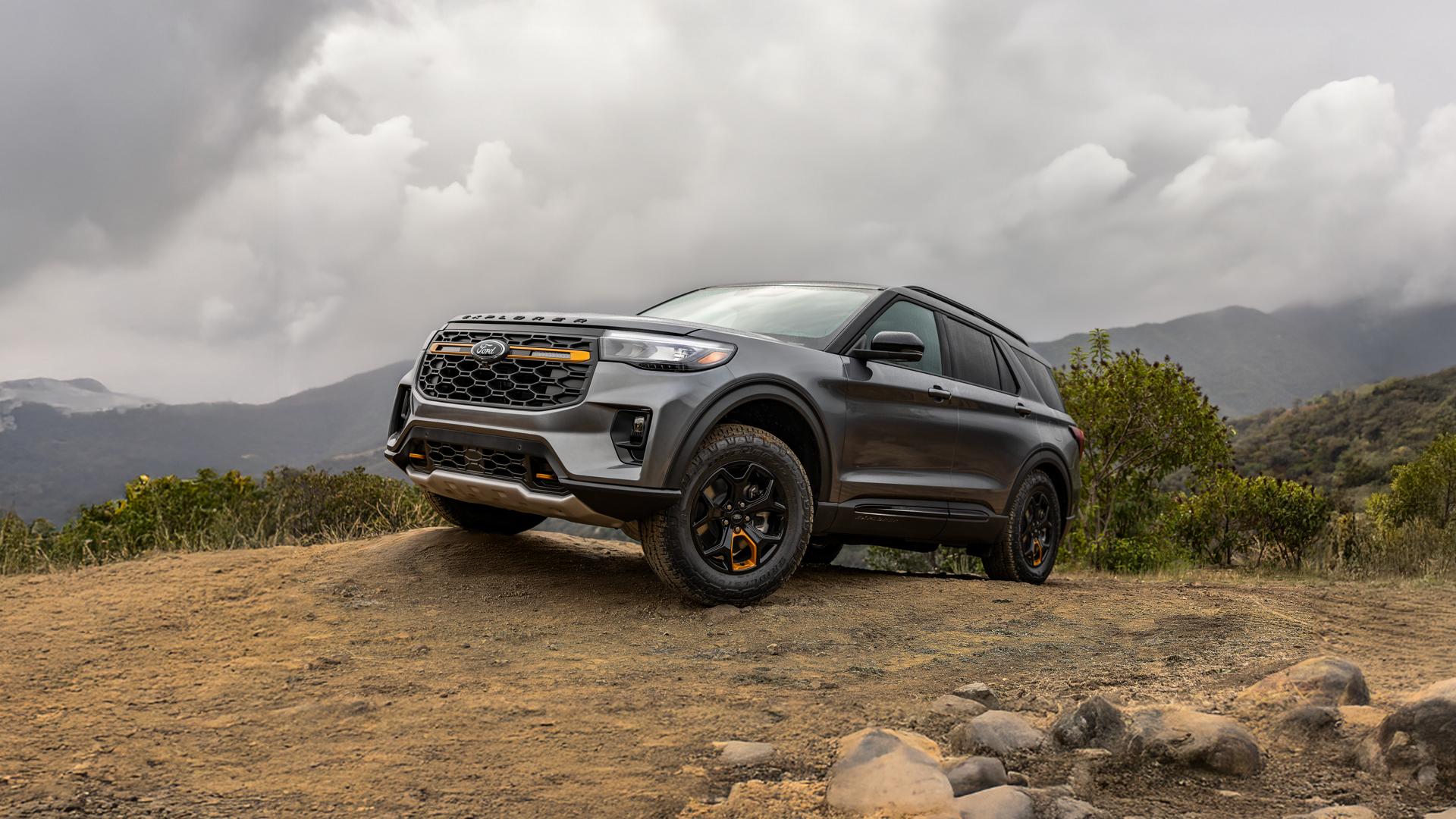 A 2026 Ford Explorer® Tremor® SUV parked atop a muddy rock