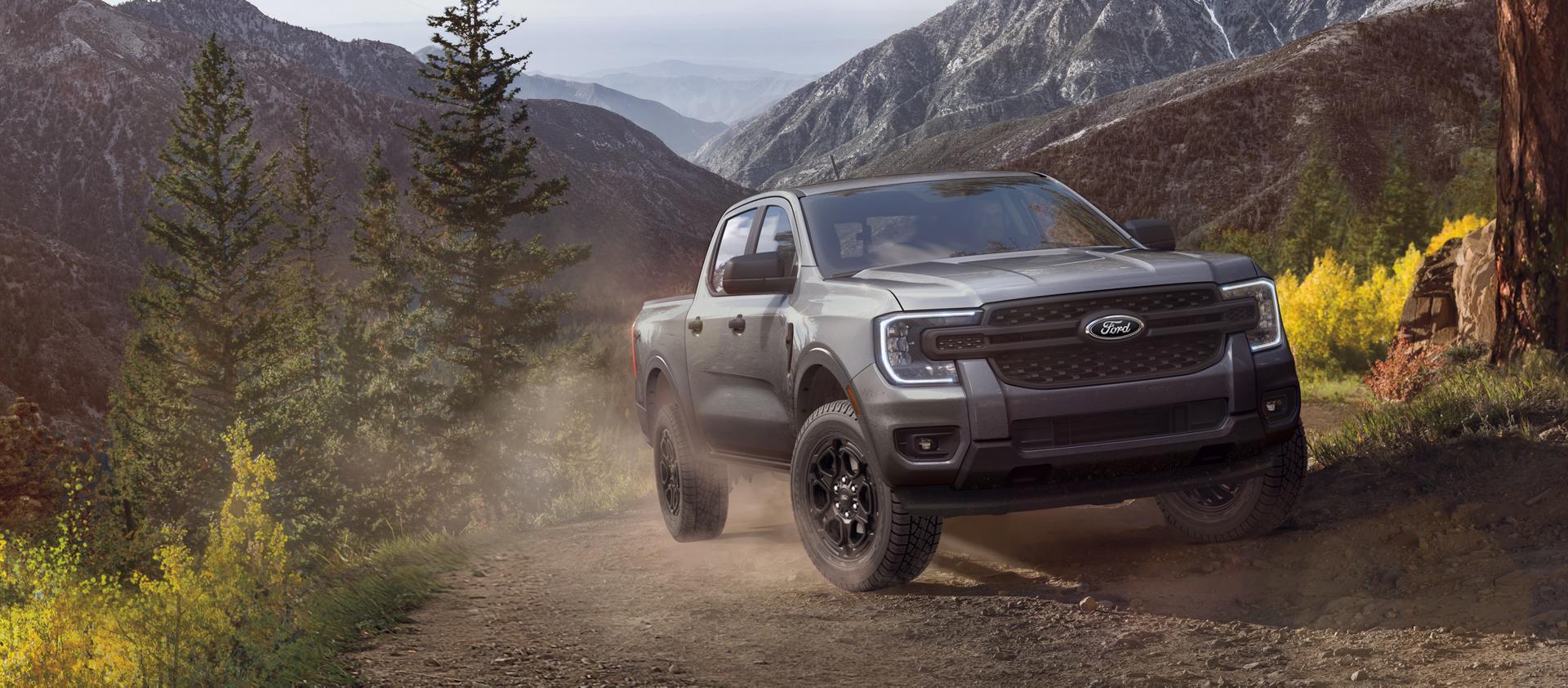 2026 Ford Ranger® XLT model with the available Black Appearance Package parked on a cliff in the mountains