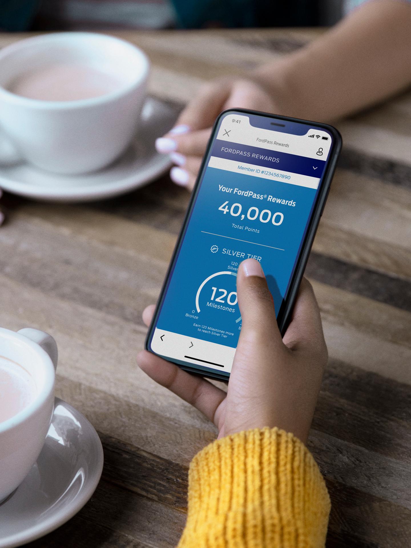A phone displaying the FordPass Rewards App.