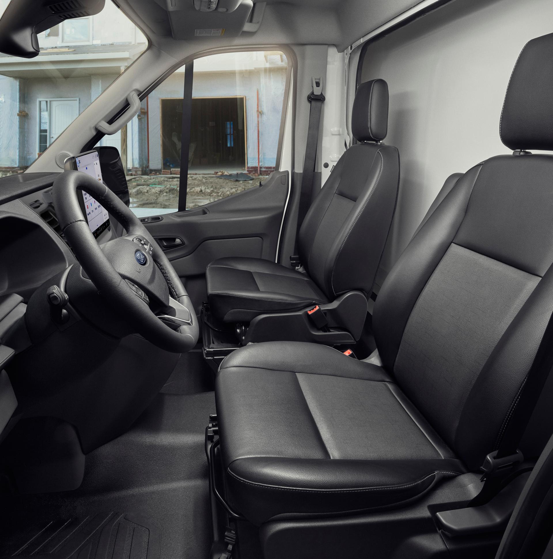 The interior of a 2026 Ford Transit® van driver's and passenger's seat