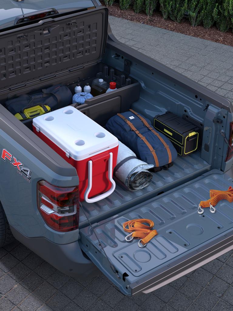 The cargo bed of a 2025 Ford Maverick XLT pickup, showing the FLEXBED® Storage System