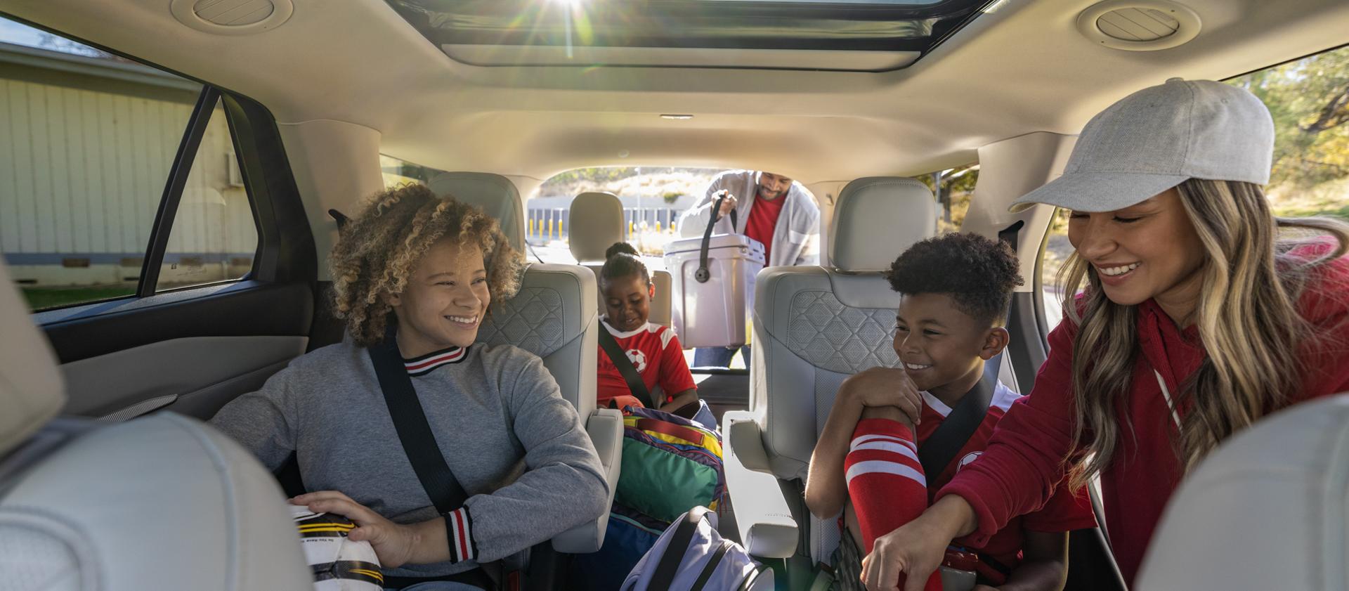 A family loading into a 2026 Ford Explorer® SUV