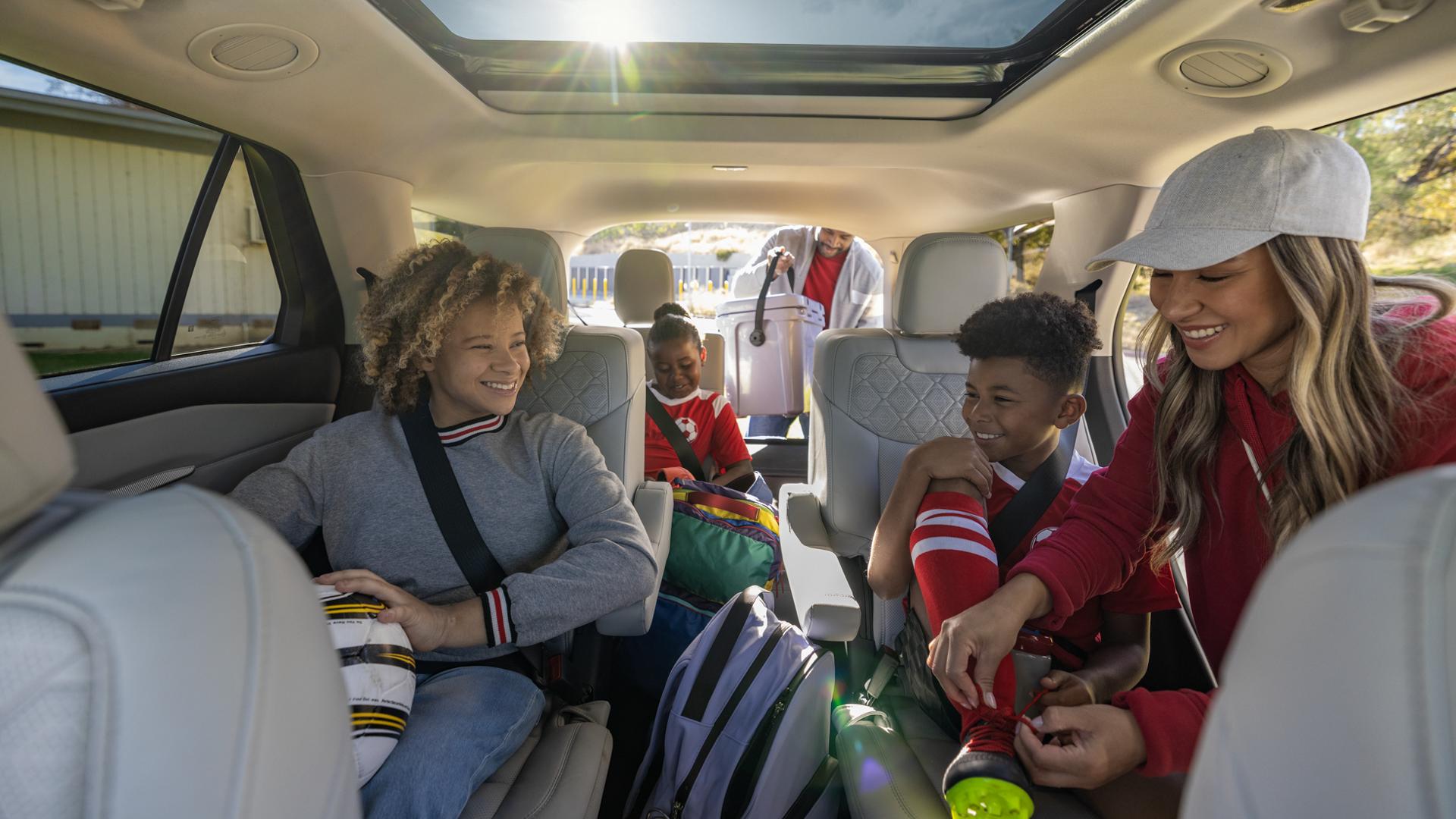 A family loading into a 2026 Ford Explorer® SUV