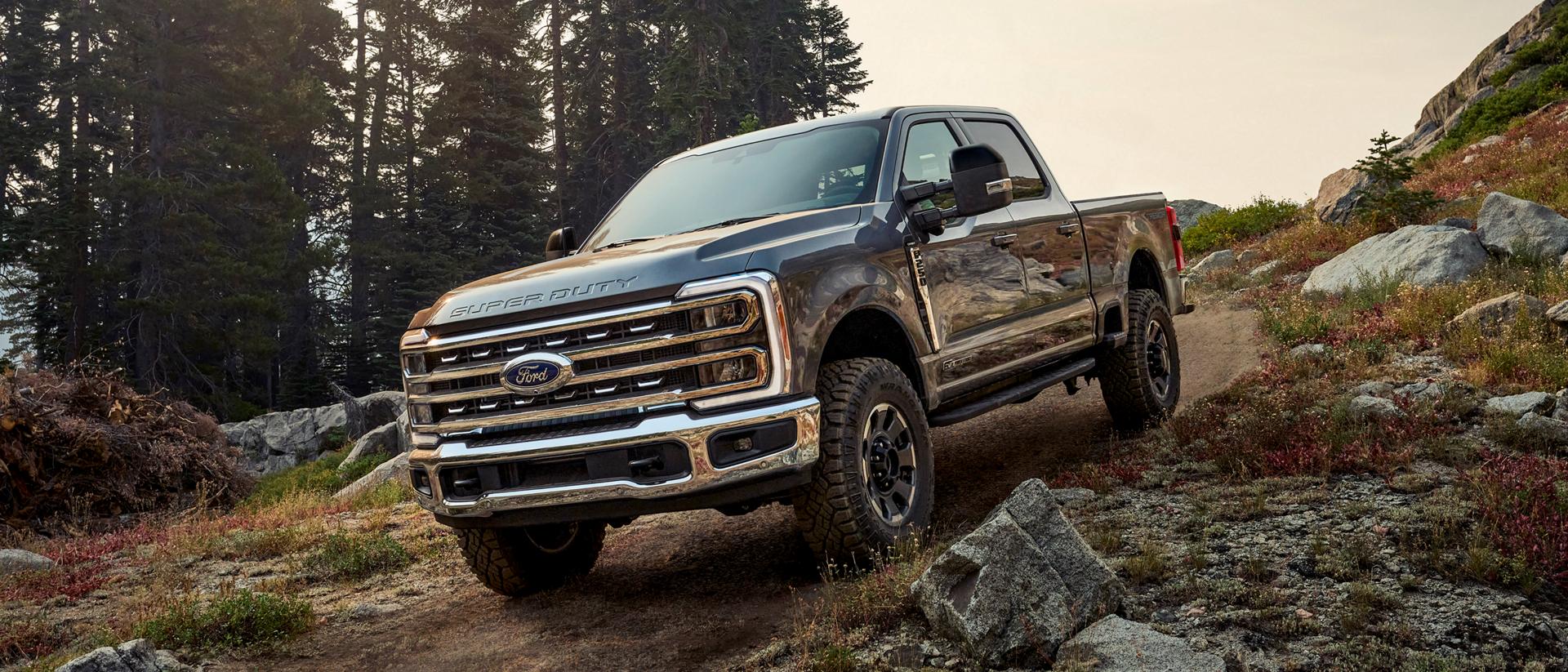 2026 Ford Super Duty® F-250® with the Tremor® Off-Road Package parked on a rocky, mountainous dirt road