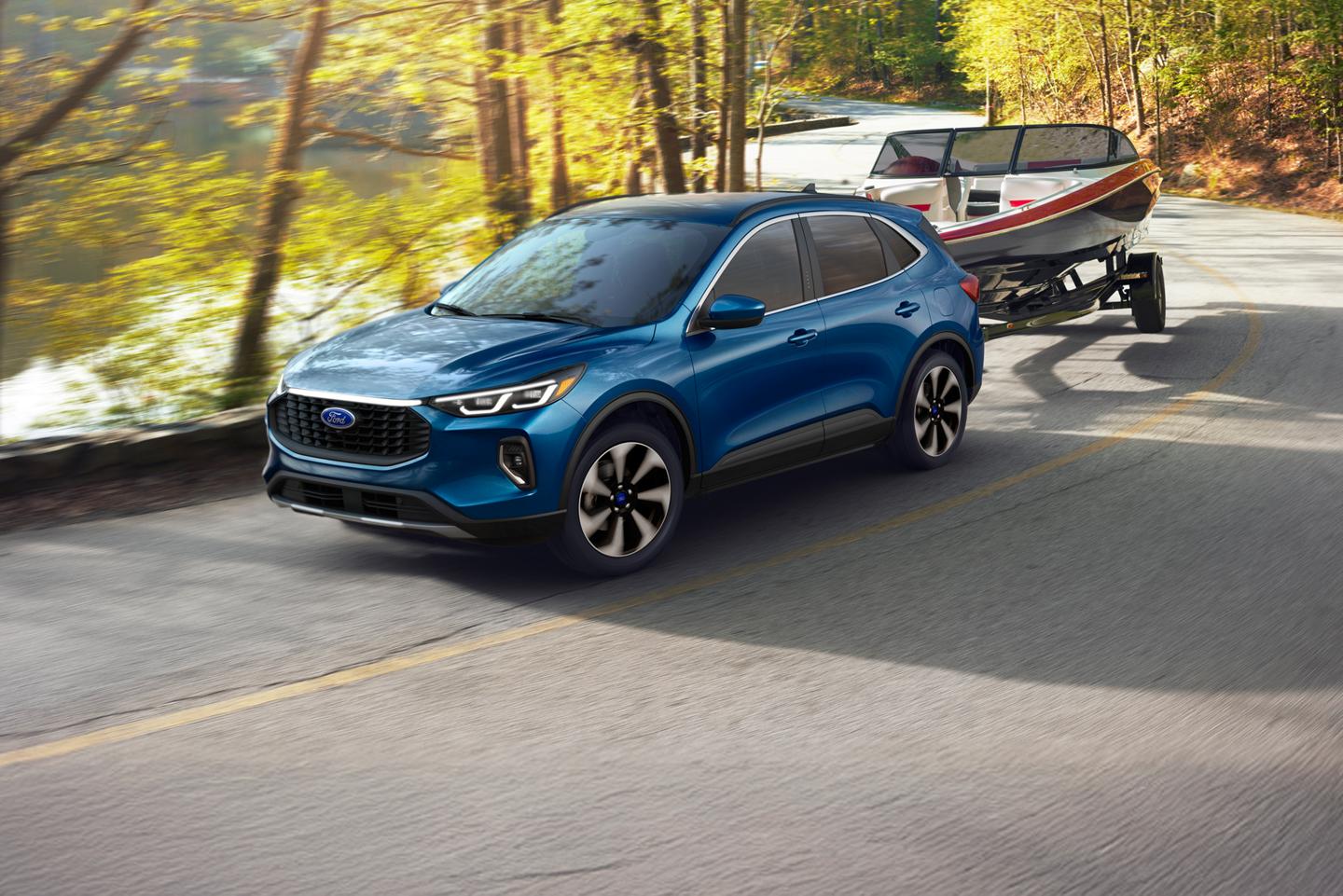 Ford Escape towing a boat on a two-lane highway.