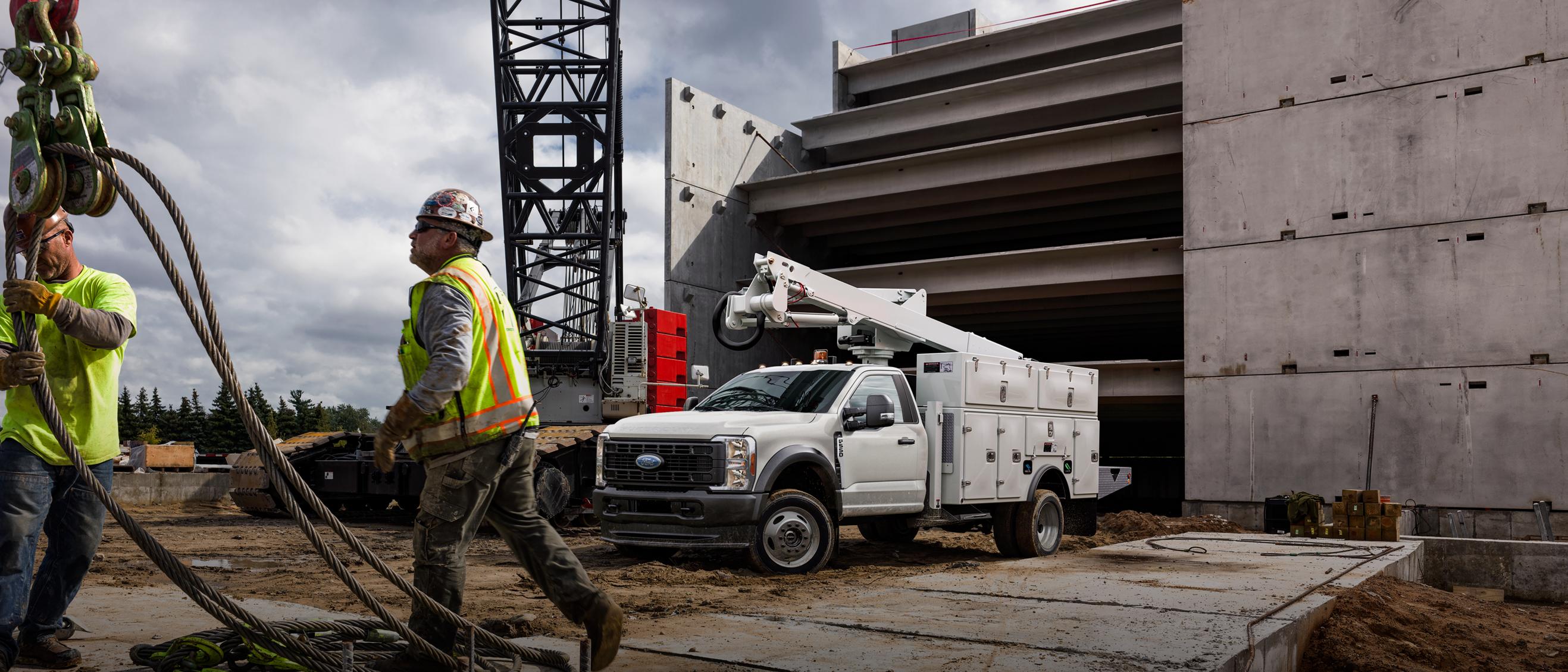 A White 2026 Ford Super Duty® Chassis Cab with a boom extension and utility box