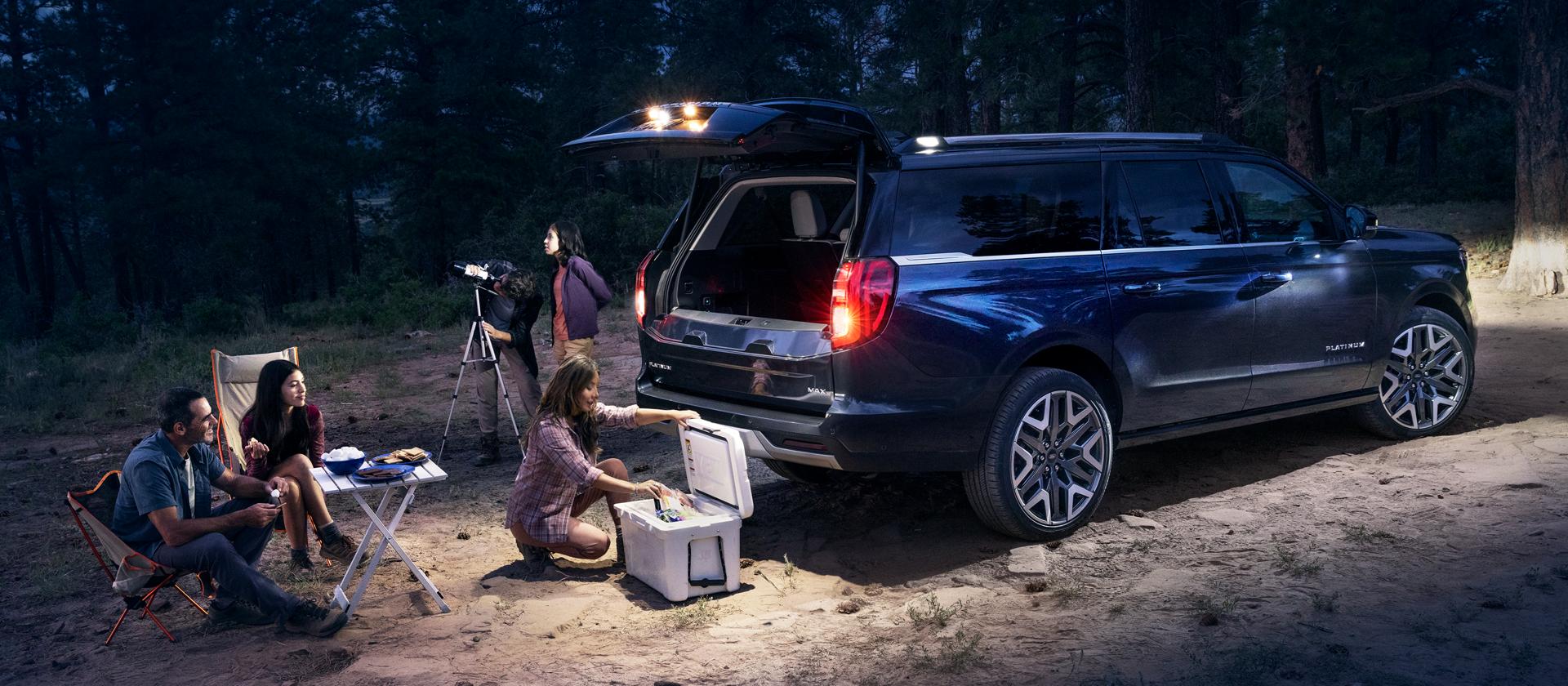 2026 Ford Expedition MAX® Platinum™ SUV with available 360-degree Zone Lighting with people nearby