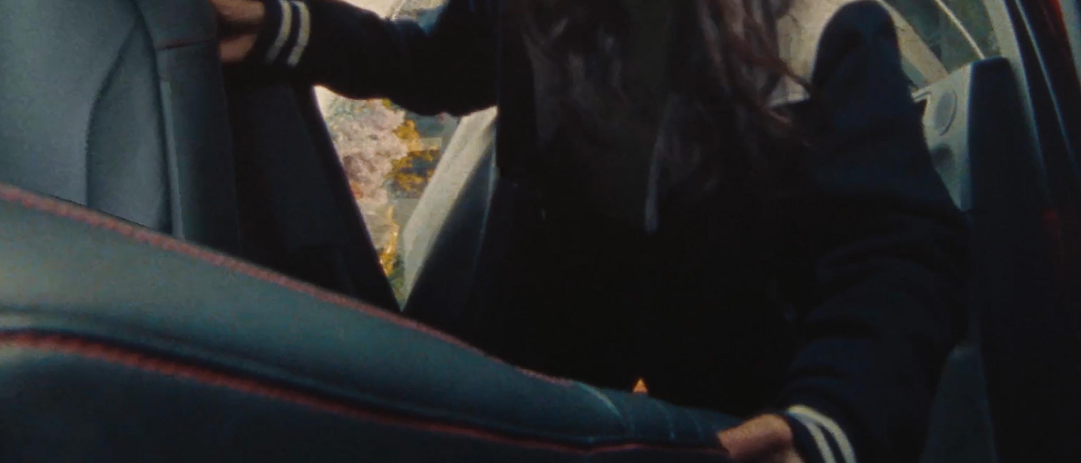 Video of a woman putting a monstera plant into the adjustable second row of a 2026 Ford Escape® SUV