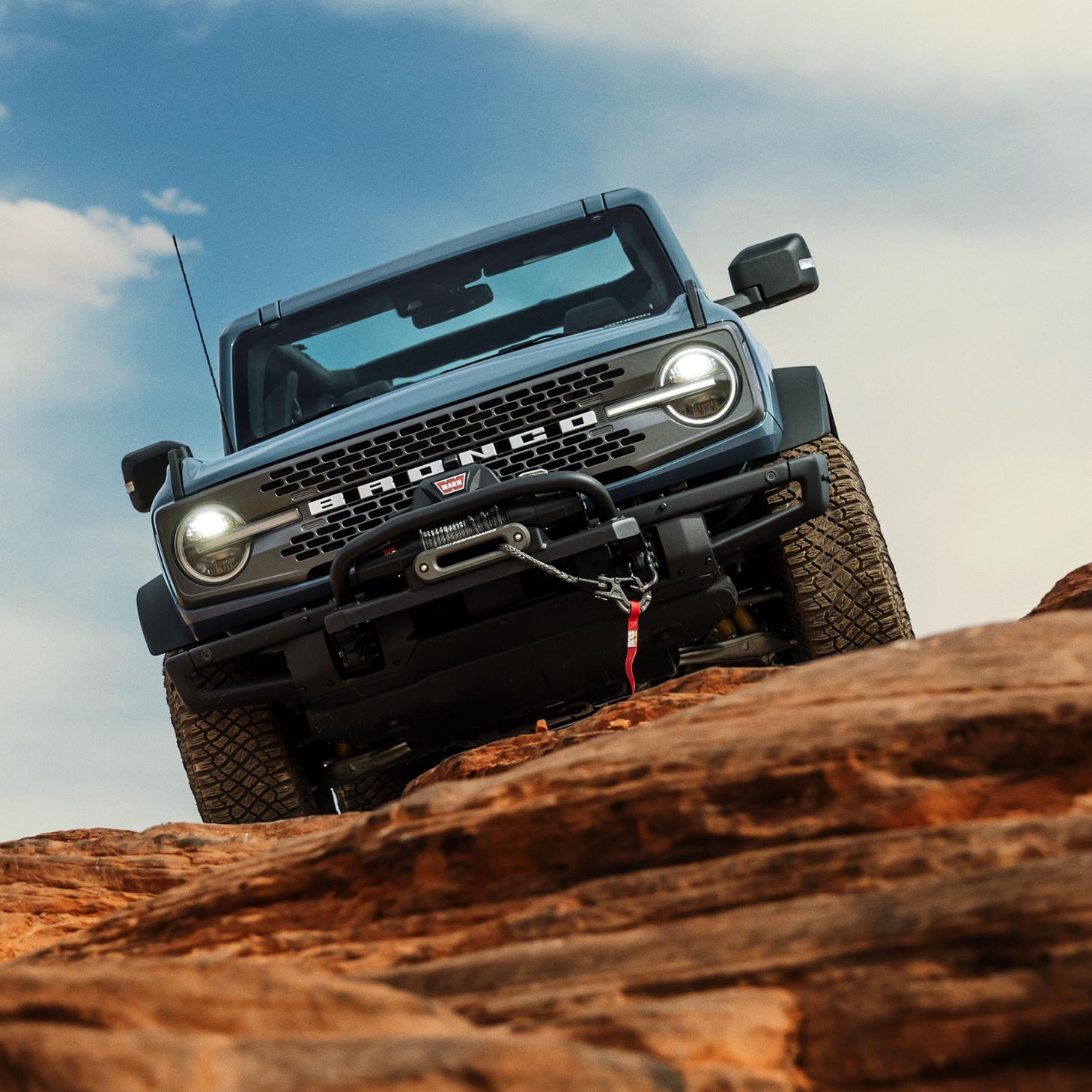The Bronco descending rocky terrain. 