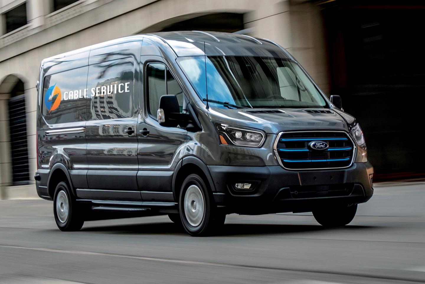 E-Transit driving on an urban road.