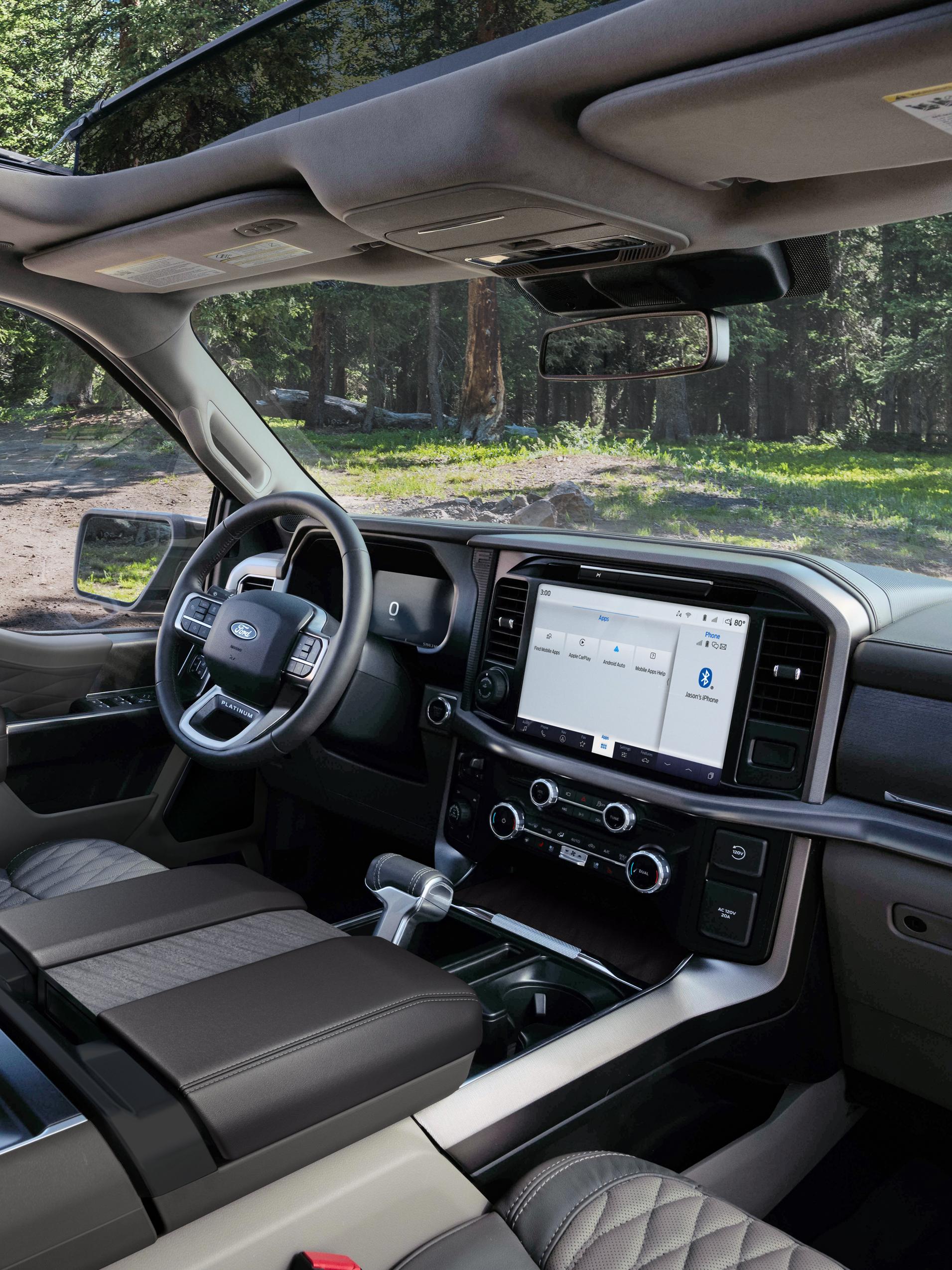 Interior of a 2026 F-150® Platinum® model parked in a wooded setting