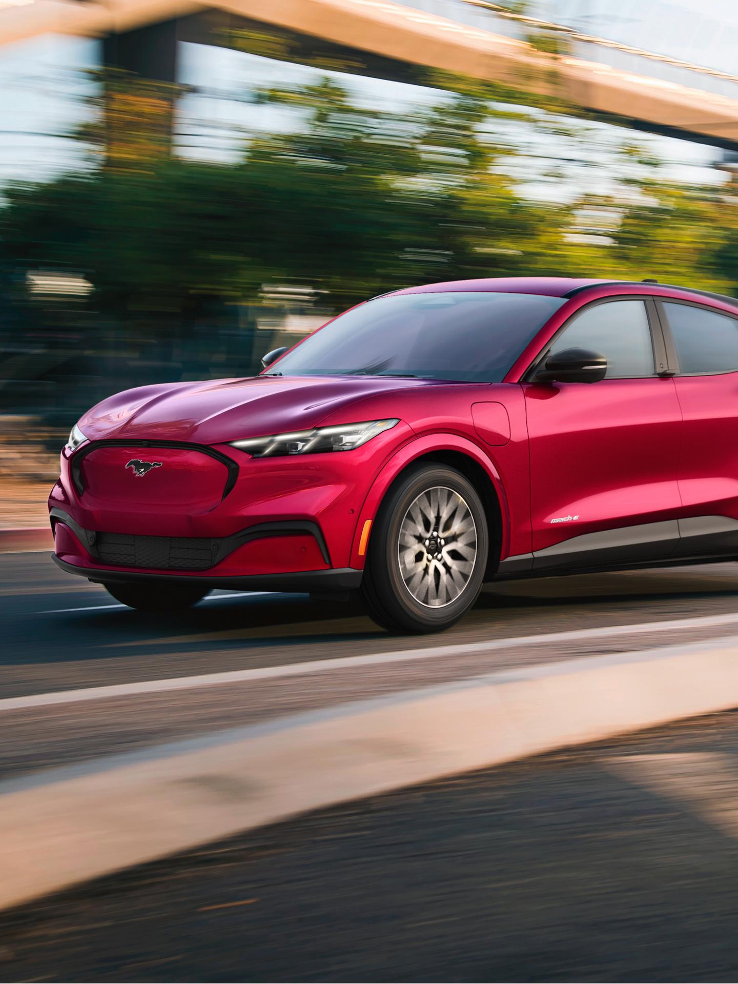 Mustang Mach-E driving on an urban road.