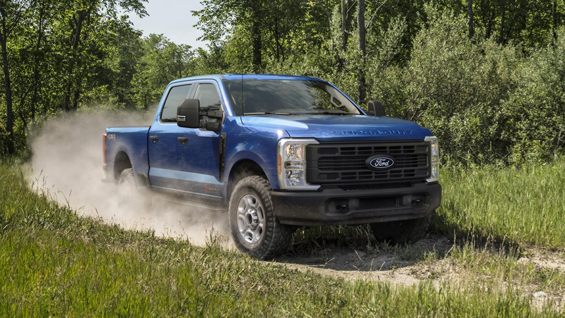 2027 Ford Super Duty® F-250® XL model kicking up dust on a two-track path