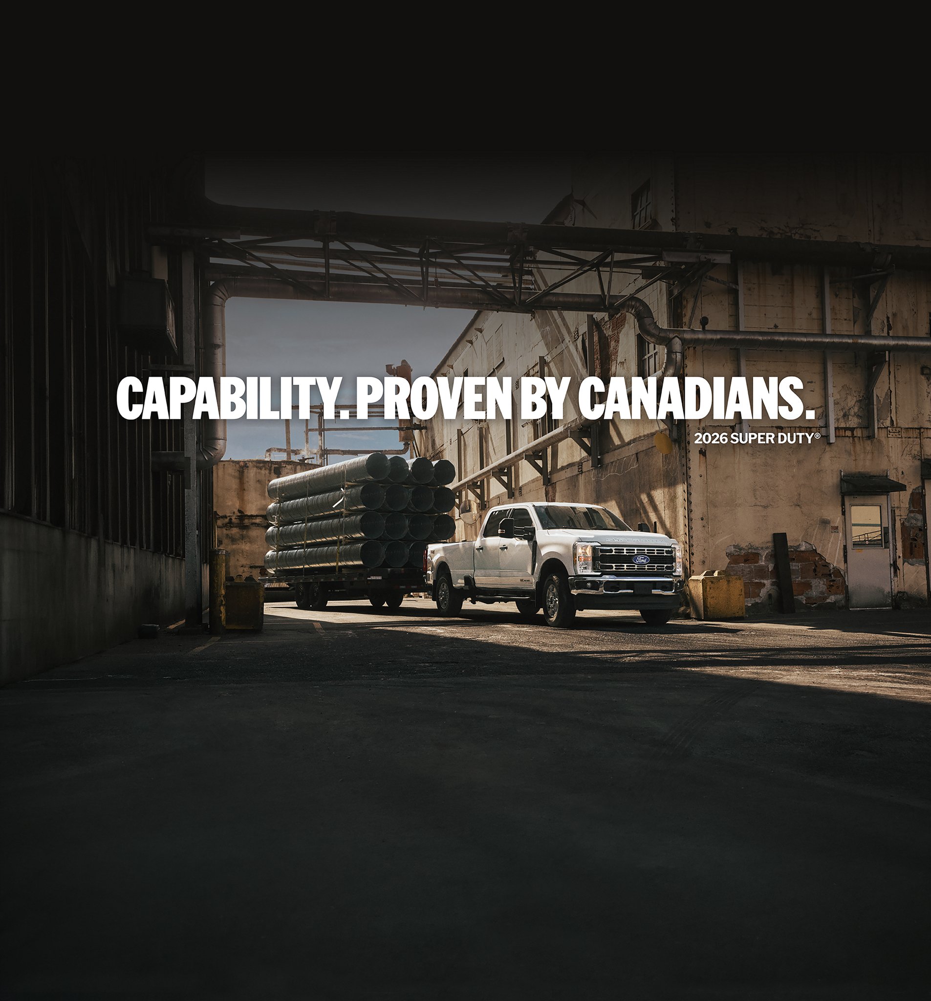 Super Duty parked at a work site with hitched trailer loaded with steel tubing. “Capability. Proven by Canadians. 2026 Super Duty”. Logo: “60 Years. Built Ford Tough. F-Series. Best-selling pickup trucks in Canada”.