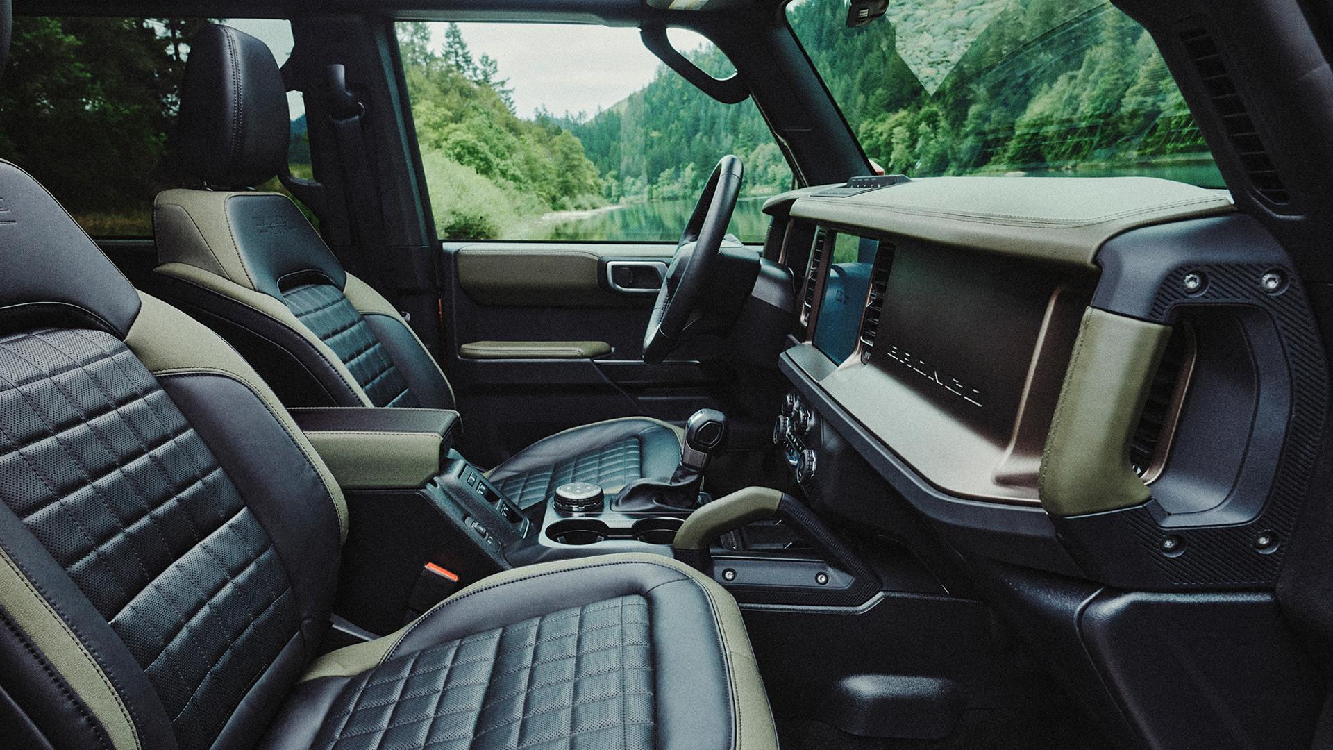 The front-row seats and dashboard inside a 2027 Ford Bronco® Filson SUV
