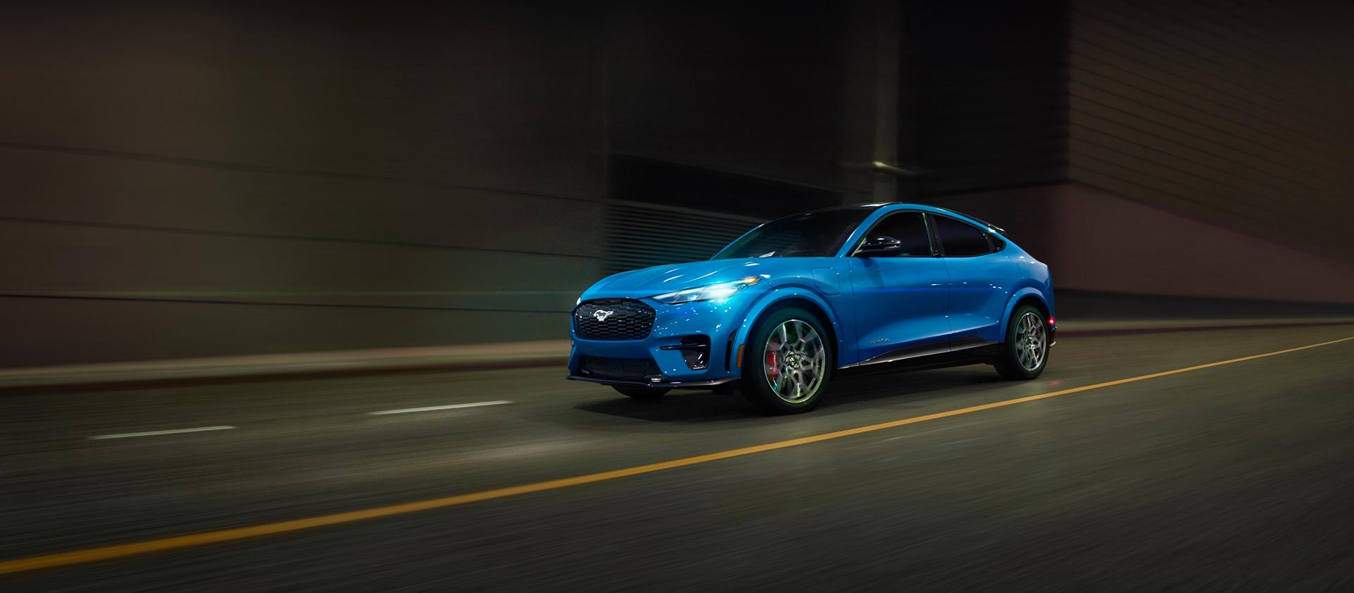 2026 Ford Mustang Mach-E® GT model being driven on a city street
