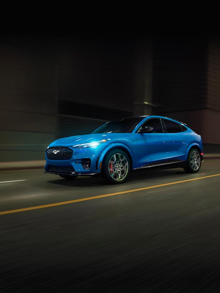 2026 Ford Mustang Mach-E® GT model being driven on a road