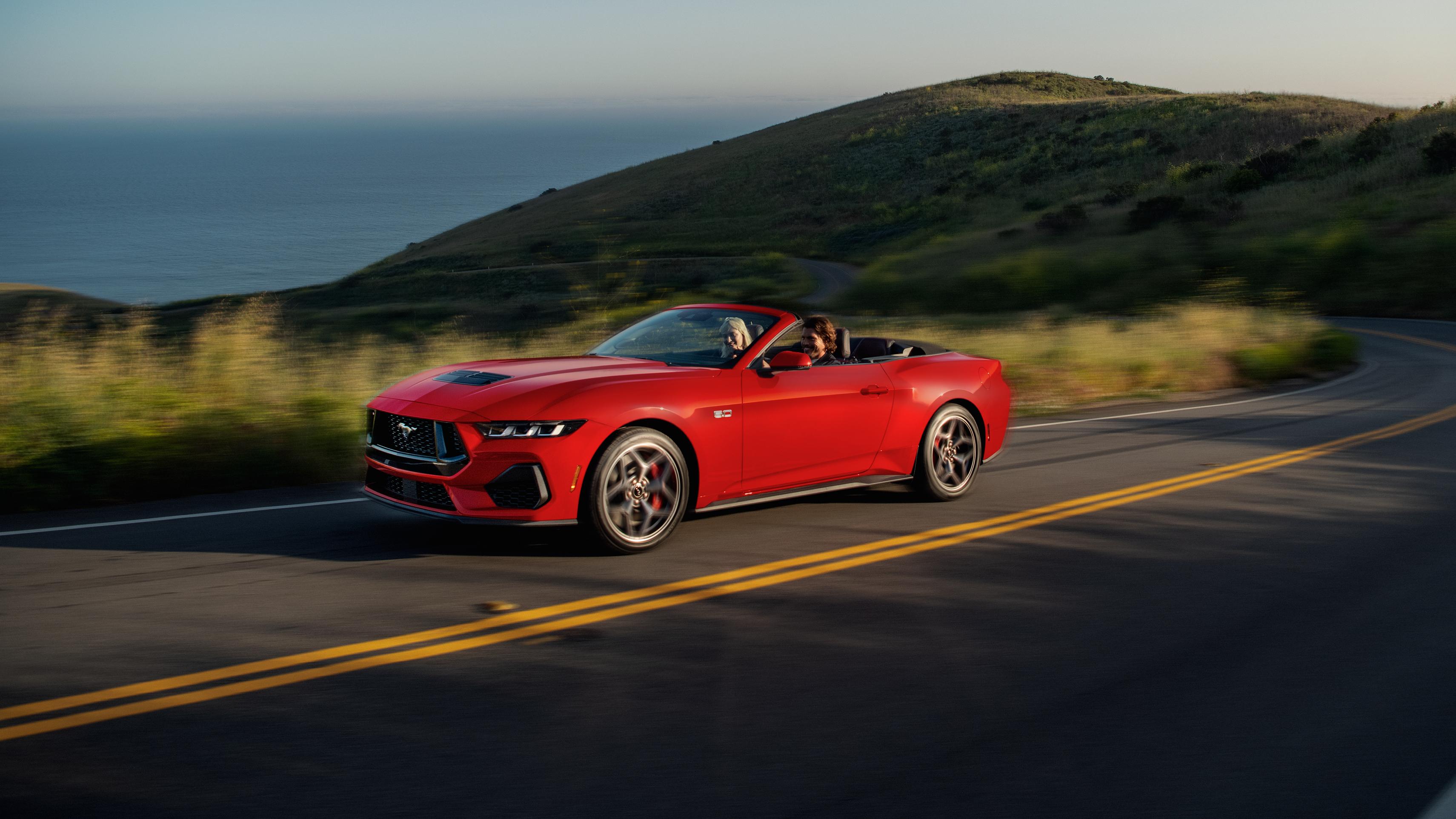 2025 Ford Mustang® GT convertible being driven on a hill