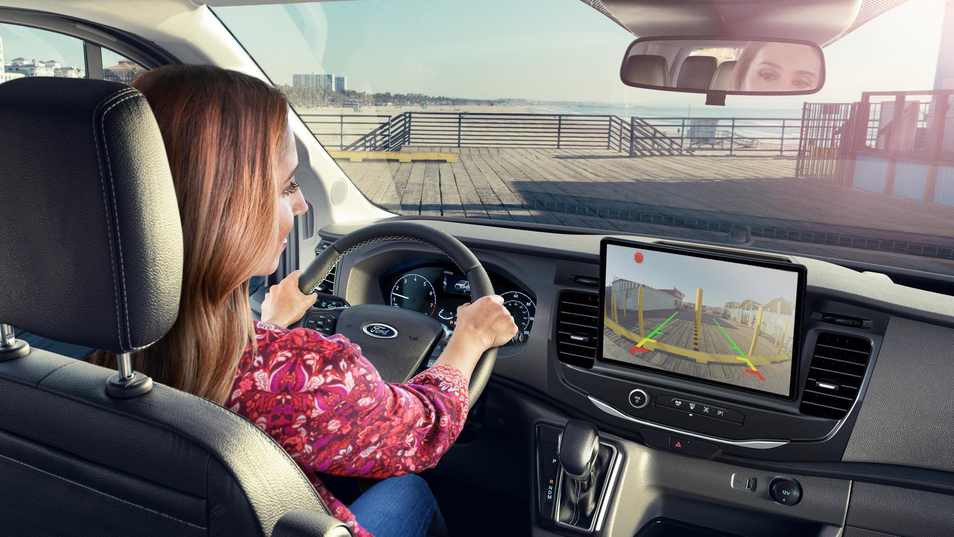 A person using the backup camera in the 2025 Ford Transit® Van