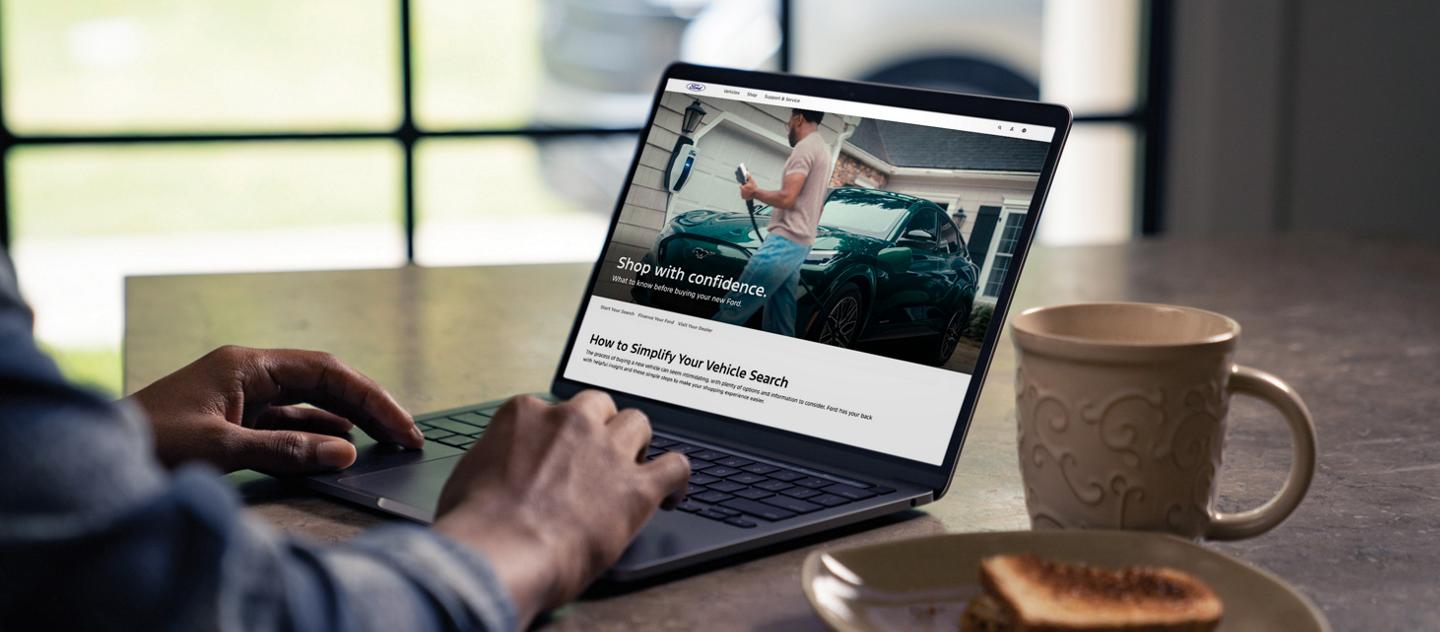 Person browsing the Shop page on a laptop.