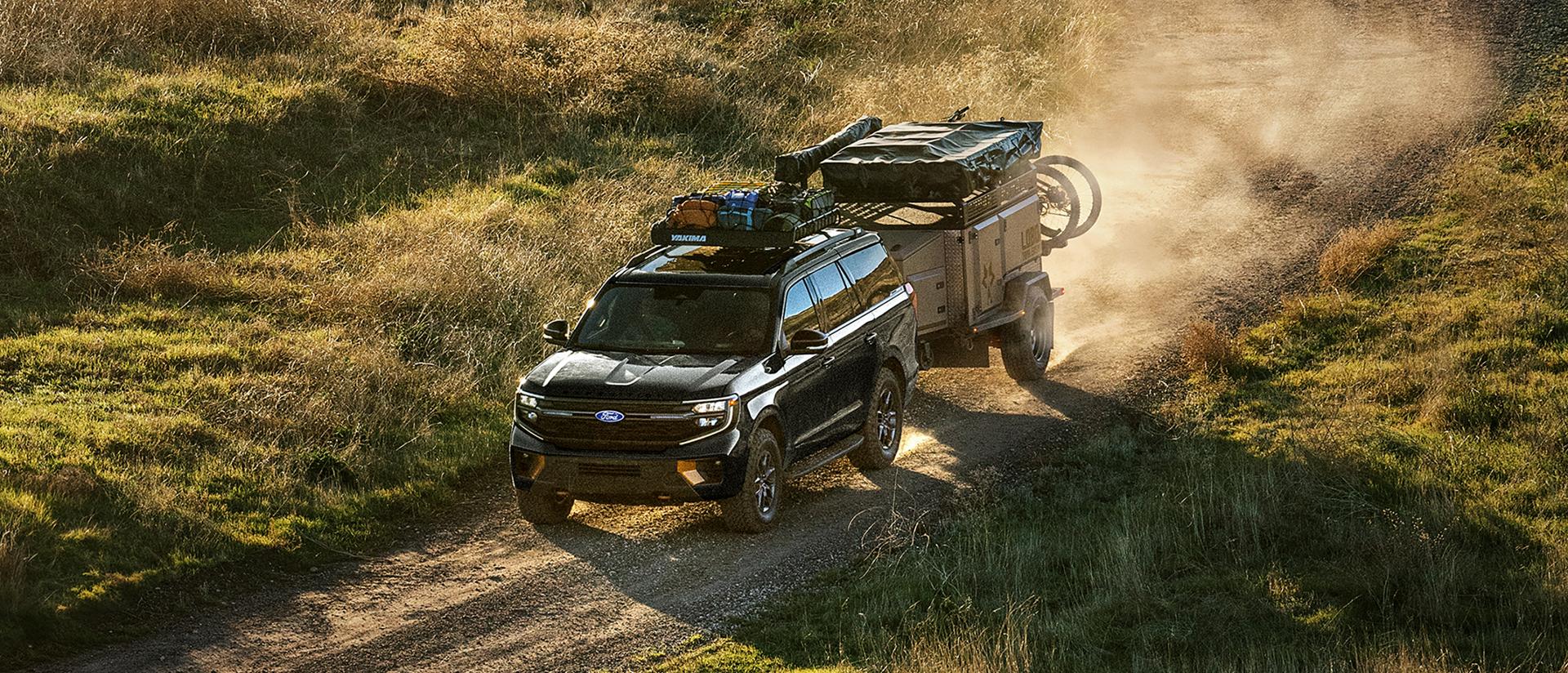 2027 Ford Expedition® Tremor® SUV with optional equipment and available Ford accessories shown towing a trailer