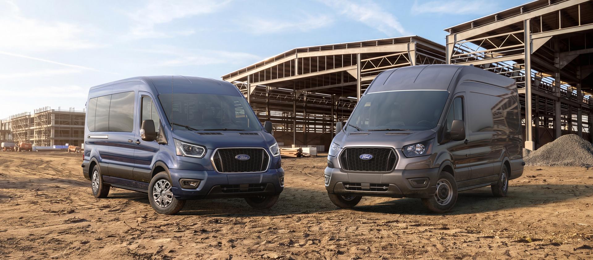 Two 2027 Ford Transit® vans, a blue passenger and a grey cargo, at a construction site