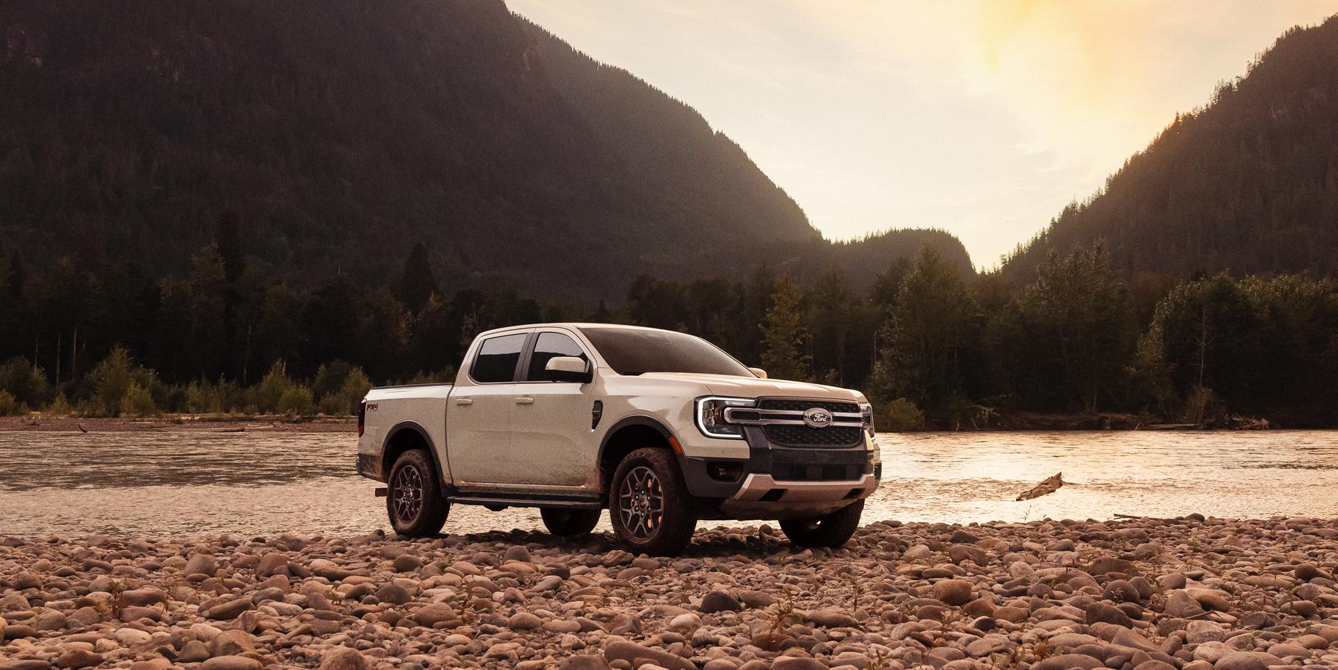 2026 Ford Ranger® Lariat® model with the FX4® Off-Road Package parked mountainside near a rocky river