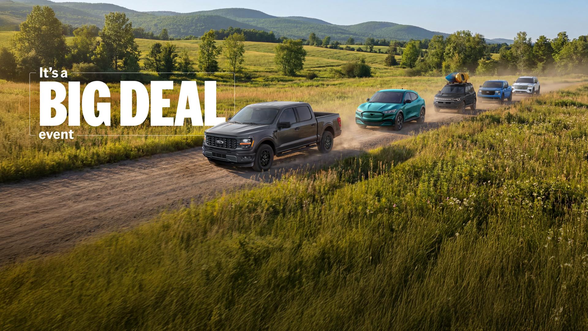 It's a big deal event. The lineup of Ford vehicles is shown from left to right: F-150, Mach-E, Bronco Sport, Maverick, and Explorer.