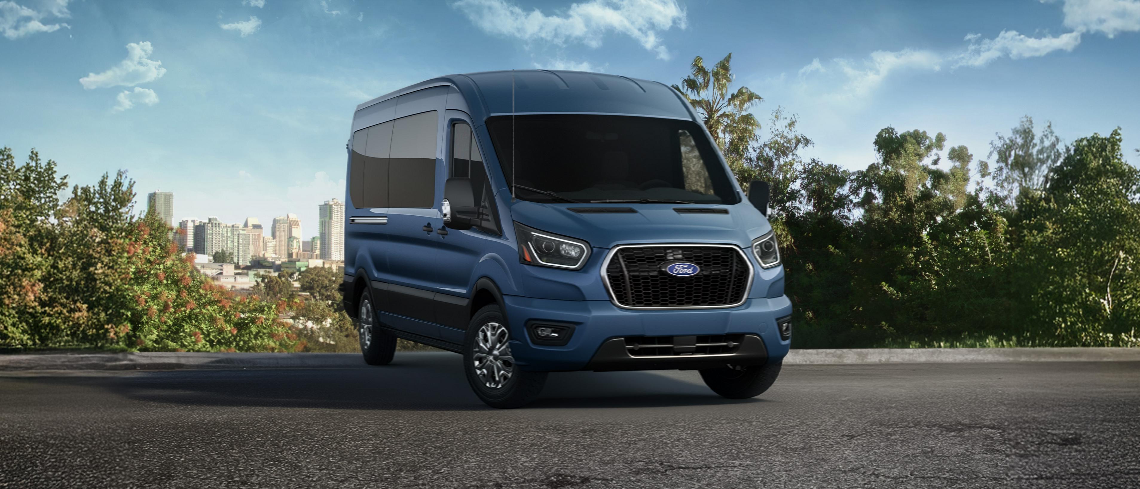 Blue 2026 Ford Transit® van parked overlooking a city horizon